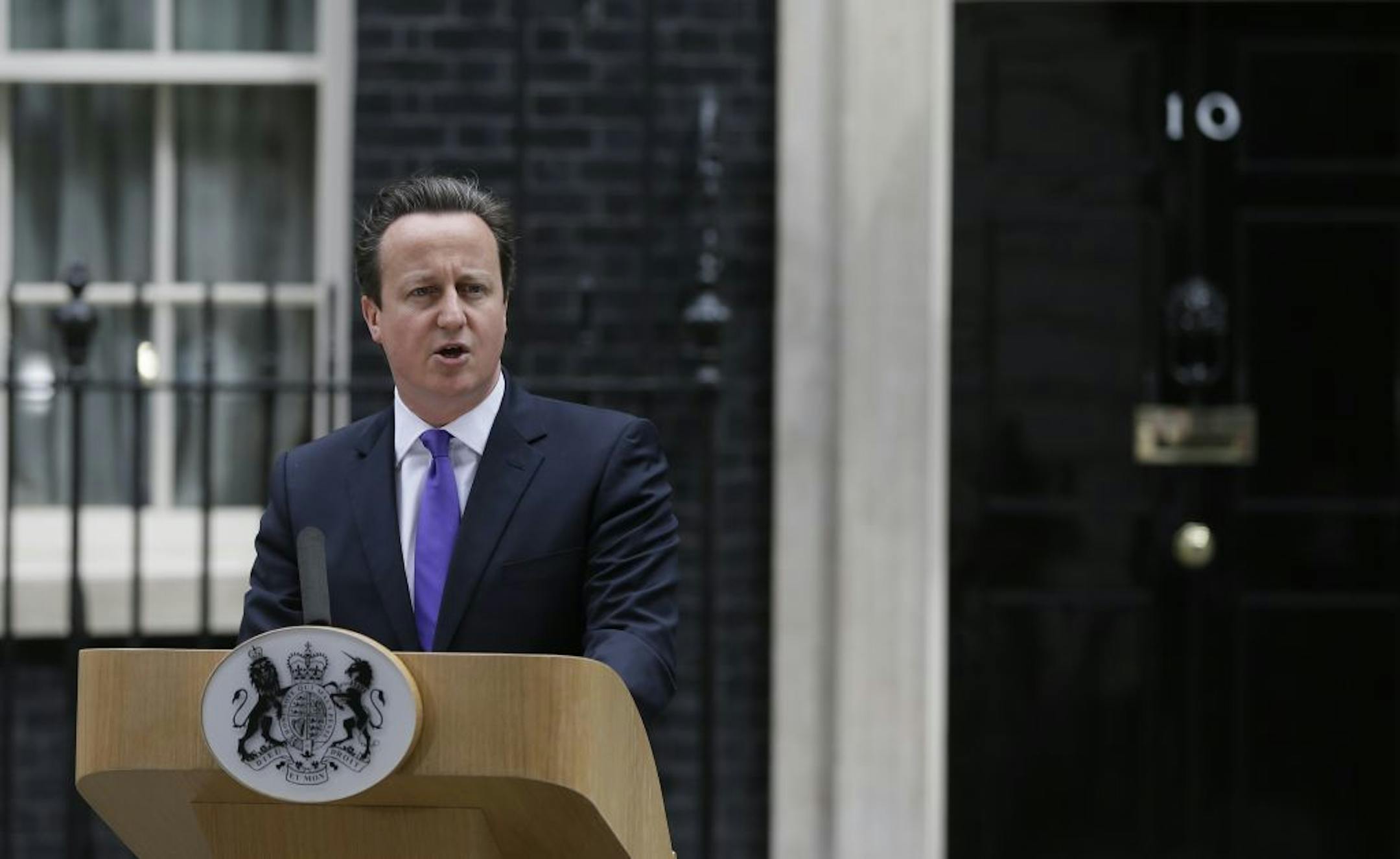 Britain's Prime Minister David Cameron speaking to the media outside 10 Downing Street in London, Thursday, May 23, 2013. The British government's emergency committee met Thursday after two attackers butchered a British soldier in a daylight attack in London that raised fears terrorism had returned to the capital. Prime Minister David Cameron says there are strong indications it was an act of terrorism, and his top advisers will be examining the potential security implications of the attack, whi