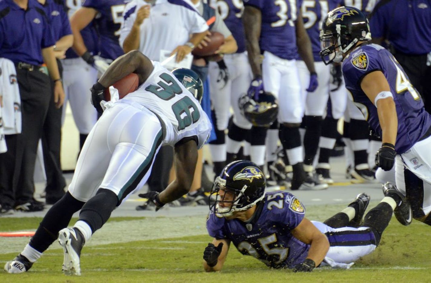 Philadelphia Eagles running back Ronnie Brown (36) turns past Baltimore Ravens cornerback Chris Carr (25), who misses the tackle, in the first quarter of the NFL preseason opener at Lincoln Financial Field in Philadelphia, Pennsylvania, on Thursday, August 11, 2011.