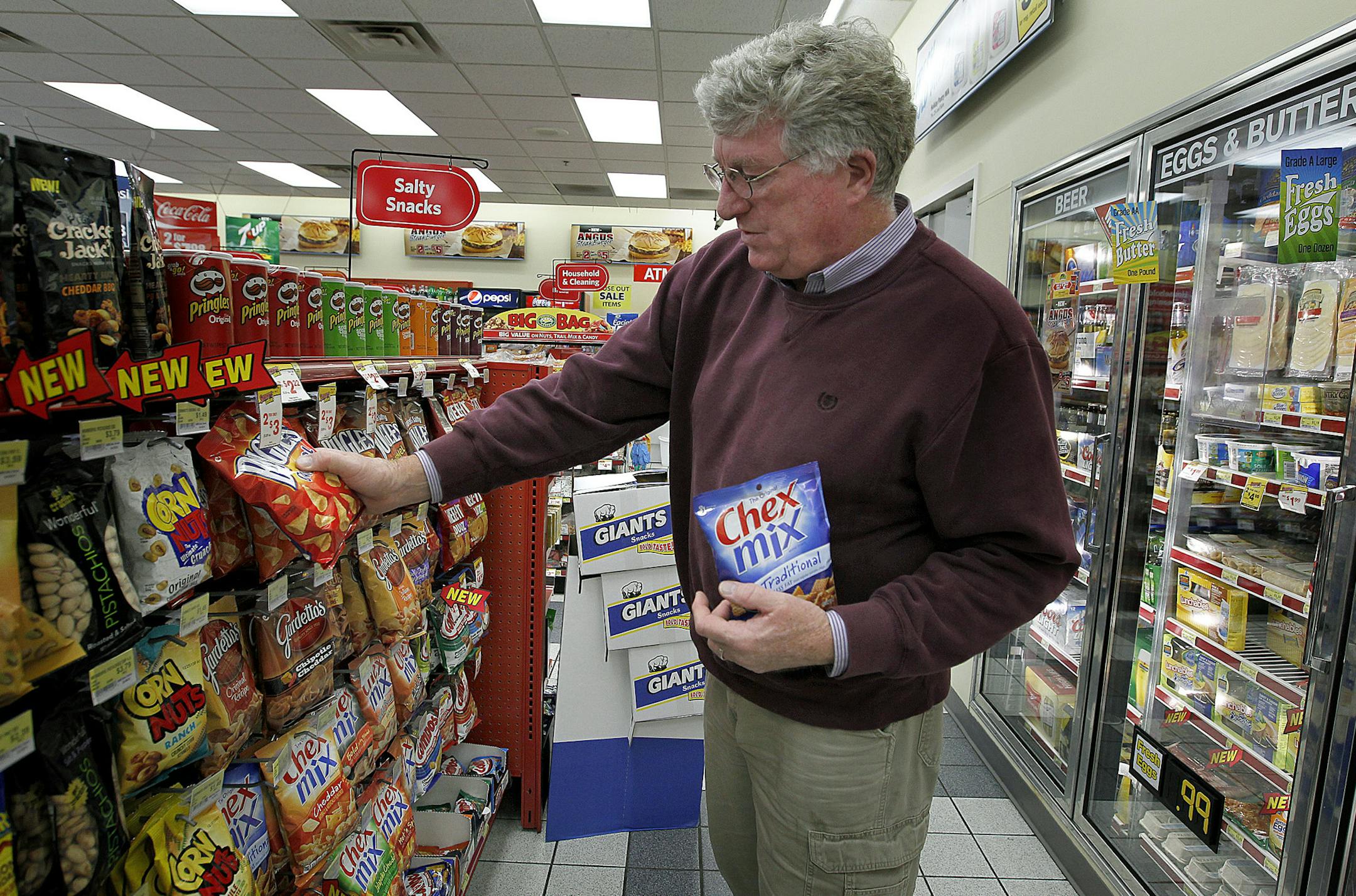 Robert Ball, who travels a lot for his job, makes frequent stops for snacks at a Holiday convenience store in Plymouth, MN, Wednesday, May 22, 2013. His favorites are Bugles chips and Chex Mix, both which are General Mills snacks. (ELIZABETH FLORES/STAR TRIBUNE) ELIZABETH FLORES • eflores@startribune.com