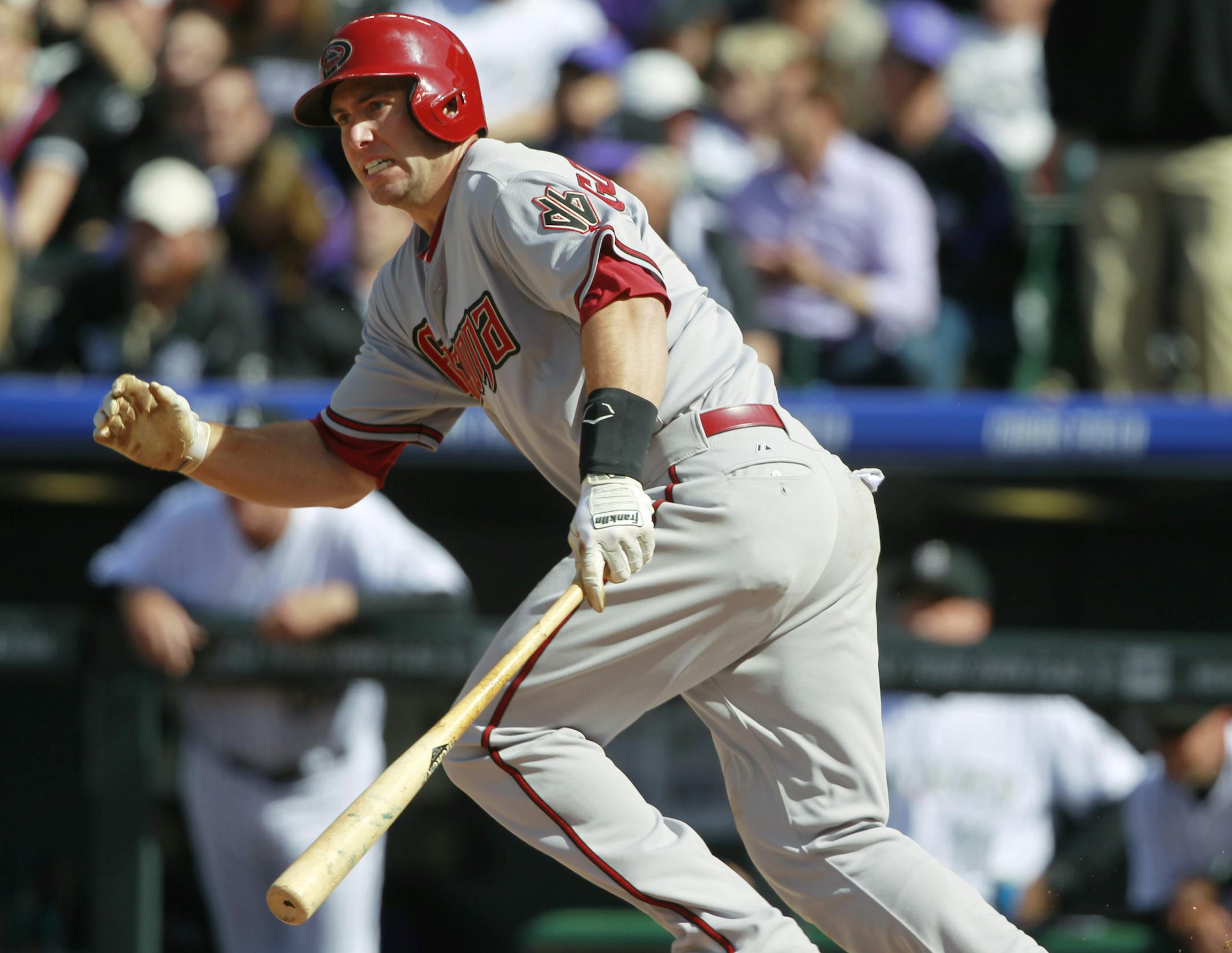 Arizona Diamondbacks' Paul Goldschmidt breaks from the batter's box after hitting a ground ball against the Colorado Rockies in the fourth inning of a baseball game in Denver on Friday, April 4, 2014. (AP Photo/David Zalubowski) ORG XMIT: NYOTK