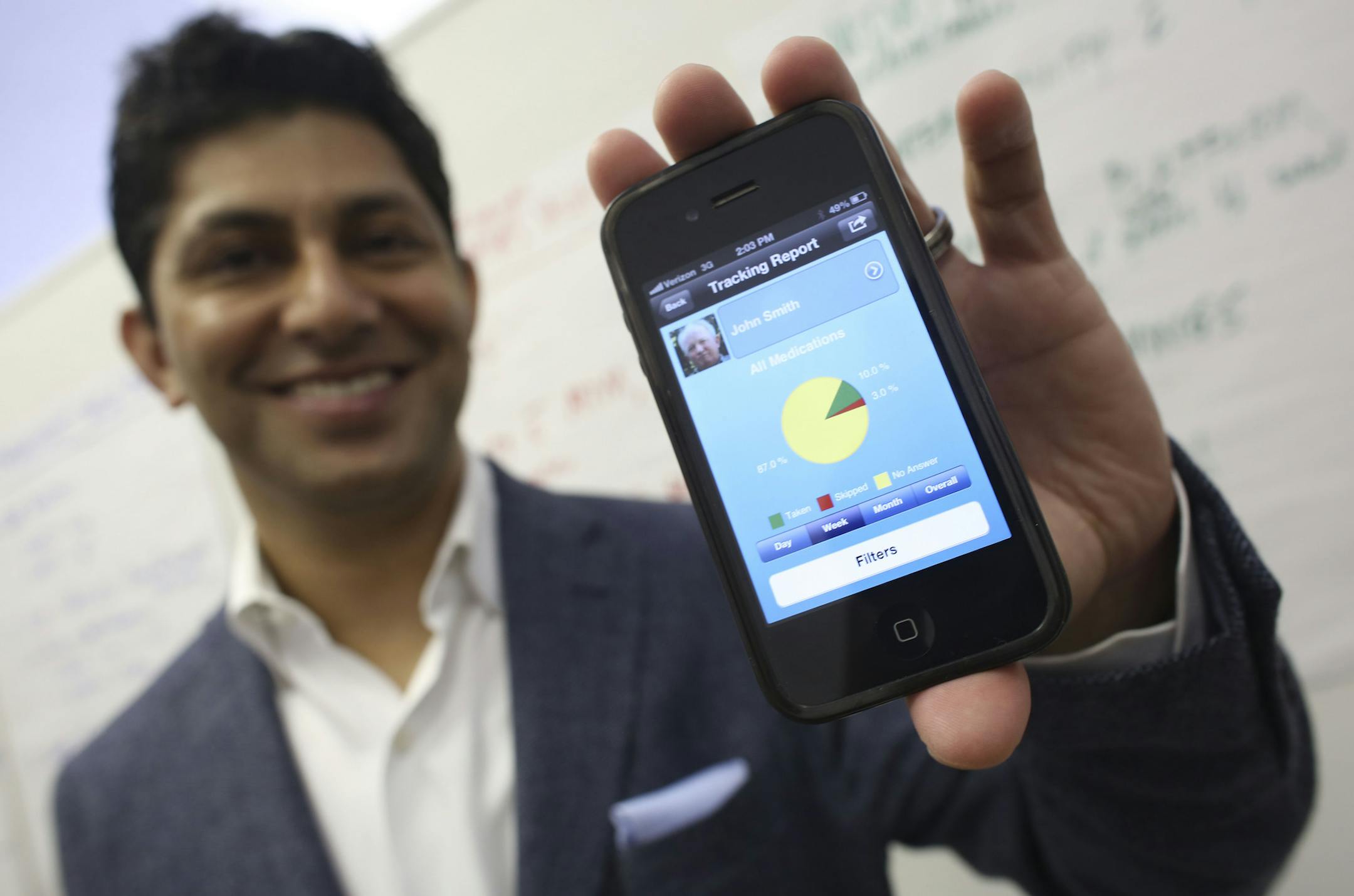 Dr. Rajiv Shad held up a smart phone with is app he create called MyMeds which is designed to make sure patients take their medications in Minneapolis Min., Thursday, July 18, 2013 . ] (KYNDELL HARKNESS/STAR TRIBUNE) kyndell.harkness@startribune.com