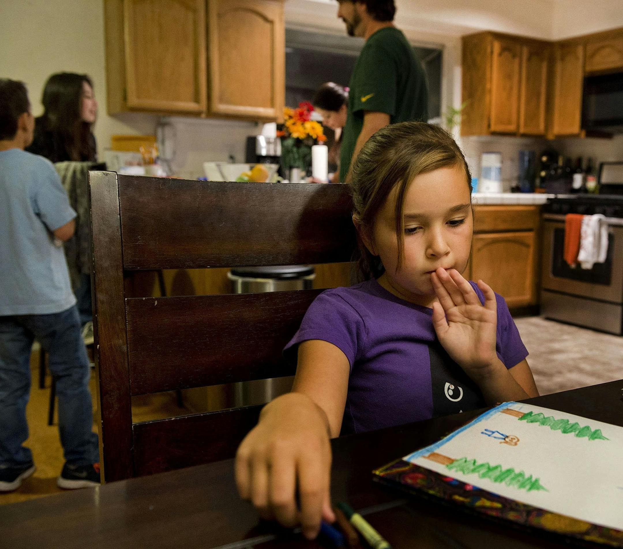 Ten-year-old Evan Whisenant beat a rare form of leukemia in 2008 and is thriving today. “It was boom, boom, boom, save her. We knew there would be side effects,” said her mother, Shannon Evan Whisenant. At home in Antelope, Calif., Evan worked on a drawing, top left, and played “Guess Who?” and baked cookies with her mom, right. Her favorites? “Snickerdoodles,” she said. “They’re Santa’s favorite, too.”