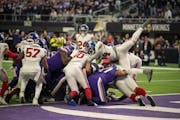 Minnesota Vikings quarterback Kirk Cousins (8) scored on a sneak in the first quarter during a NFL wild card playoff game between the Minnesota Viking