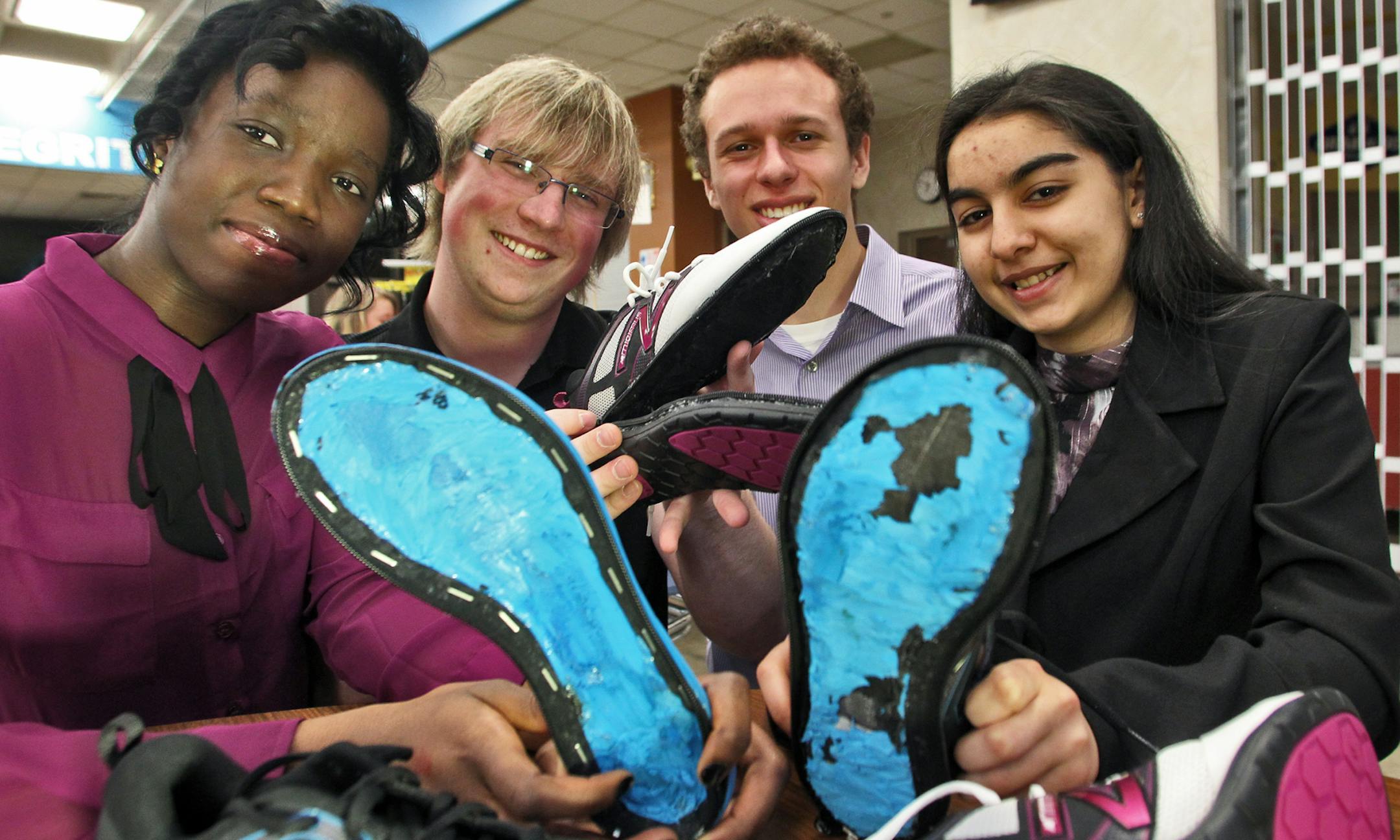 Seniors at Blaine high school enrolled in the Center for Engineering, Mathematics and Science program held a presentation night recently to display their individual projects. These students designed recreational shoes that allow the soles to be zippered on and off as they wear out. Antoinette Zoumanigui, Andy Nelson, Logan Wendt and Shilvi Joshi, l-r.
(MARLIN LEVISON/STARTRIBUNE(mlevison@startribune.com (cq -program)