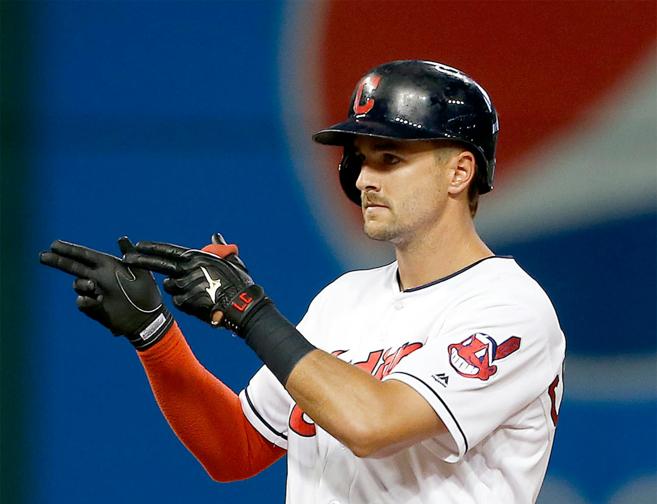 Cleveland Indians' Lonnie Chisenhall reacts after hitting an RBI double off Minnesota Twins starting pitcher Kyle Gibson during the fifth inning of a baseball game Tuesday, Aug. 2, 2016, in Cleveland.