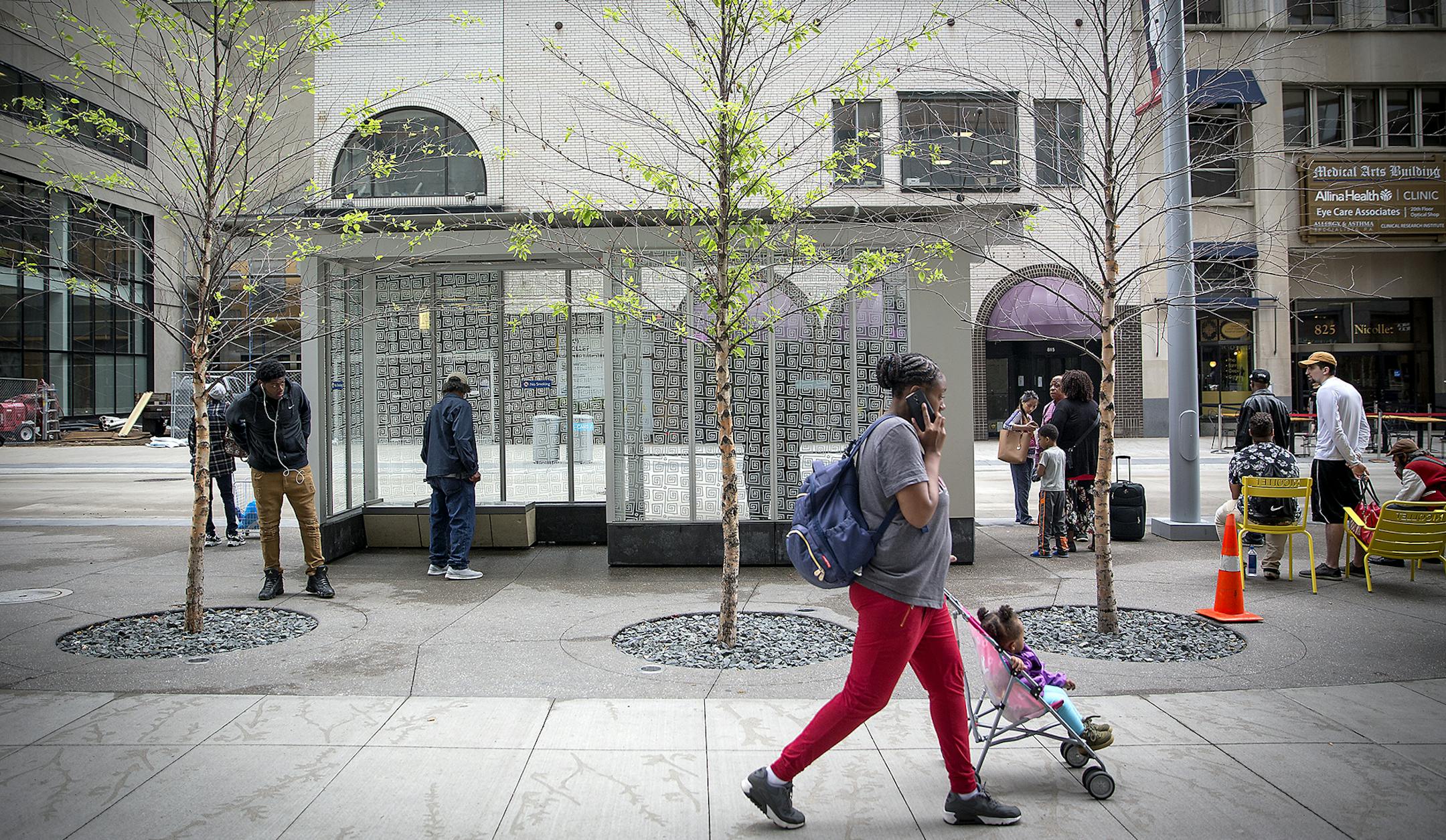 Pedestrians made their way along Nicollet Mall where the trees on the newly redesigned area are dying en masse, Wednesday, June 6, 2018 in Minneapolis, MN. The city may have to replant them because they're dying so quickly. ] ELIZABETH FLORES &#xef; liz.flores@startribune.com