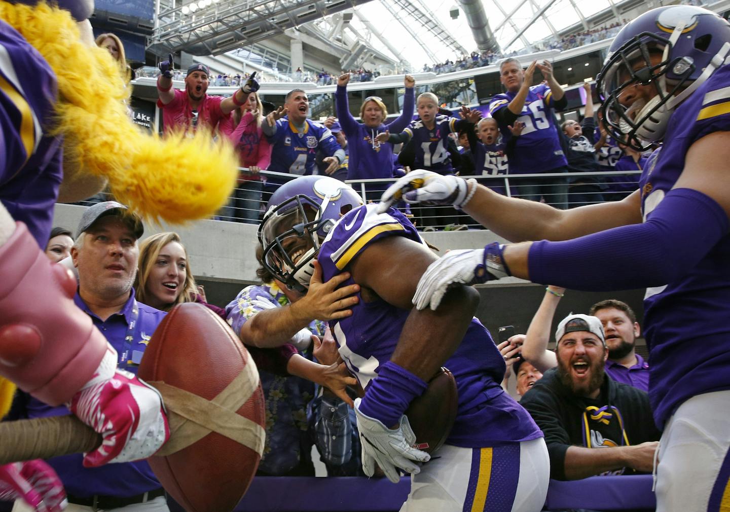 Cordarrelle Patterson is cheered by fans in the end zone after his fourth quarter touchdown.