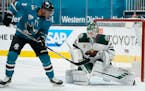 Minnesota Wild goaltender Kaapo Kahkonen (34) blocks a shot by San Jose Sharks left wing Evander Kane (9) during the first period of an NHL hockey gam