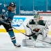 Minnesota Wild goaltender Kaapo Kahkonen (34) blocks a shot by San Jose Sharks left wing Evander Kane (9) during the first period of an NHL hockey gam