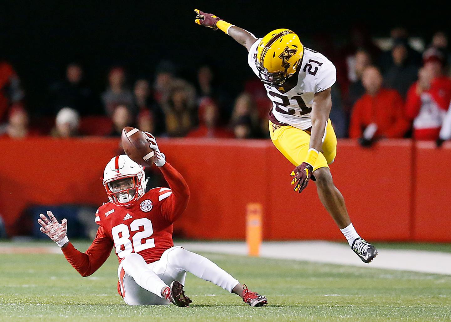 Nebraska's wide receiver Alonzo Moore made a grab despite Gophers defensive back Ray Buford's efforts during the fourth quarter on Nov. 12.