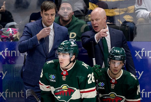 New Wild head coach John Hynes and assistant Darby Hendrickson during Tuesday night’s victory over St. Louis at Xcel Energy Center.