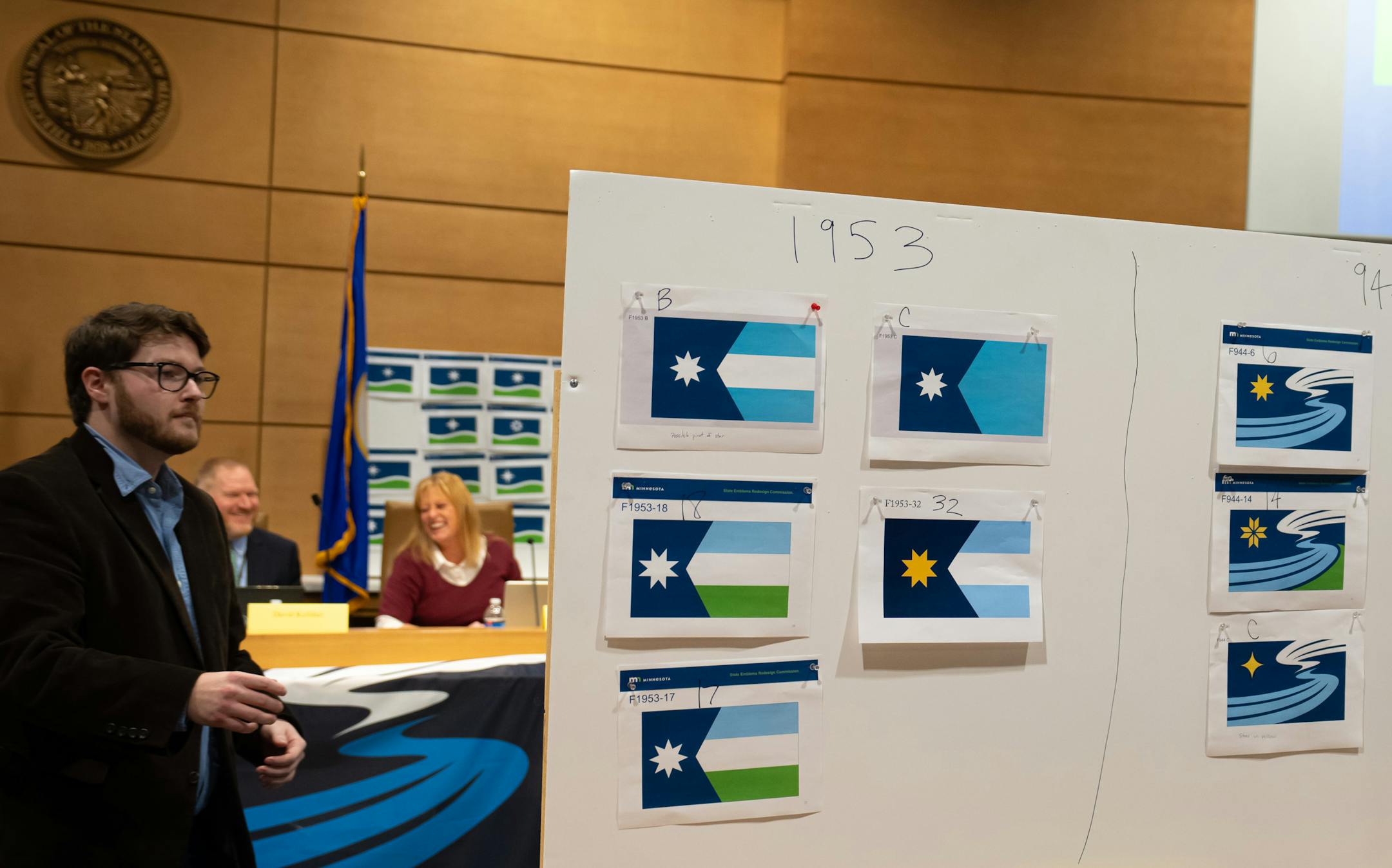 The concept on the left marked 1953 was chosen over the concept on the right, 944, which was eliminated Friday, Dec. 15, 2023 St. Paul, Minn. A commission tasked with redesigning Minnesota's state flag meets Friday to consider three top designs, all bearing an image of the North Star. The State Emblems Redesign Commission will review changes to each of the three finalists and potentially choose the winning design. ] GLEN STUBBE • glen.stubbe@startribune.com