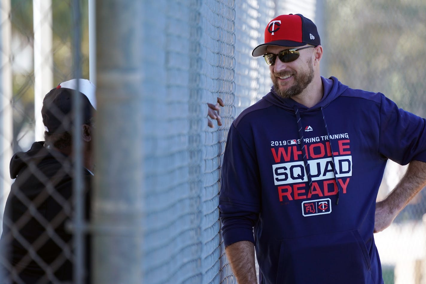 Twins manager Rocco Baldelli chatted with a fan through the fence as he watched from sidelines as players took batting practice Thursday morning.