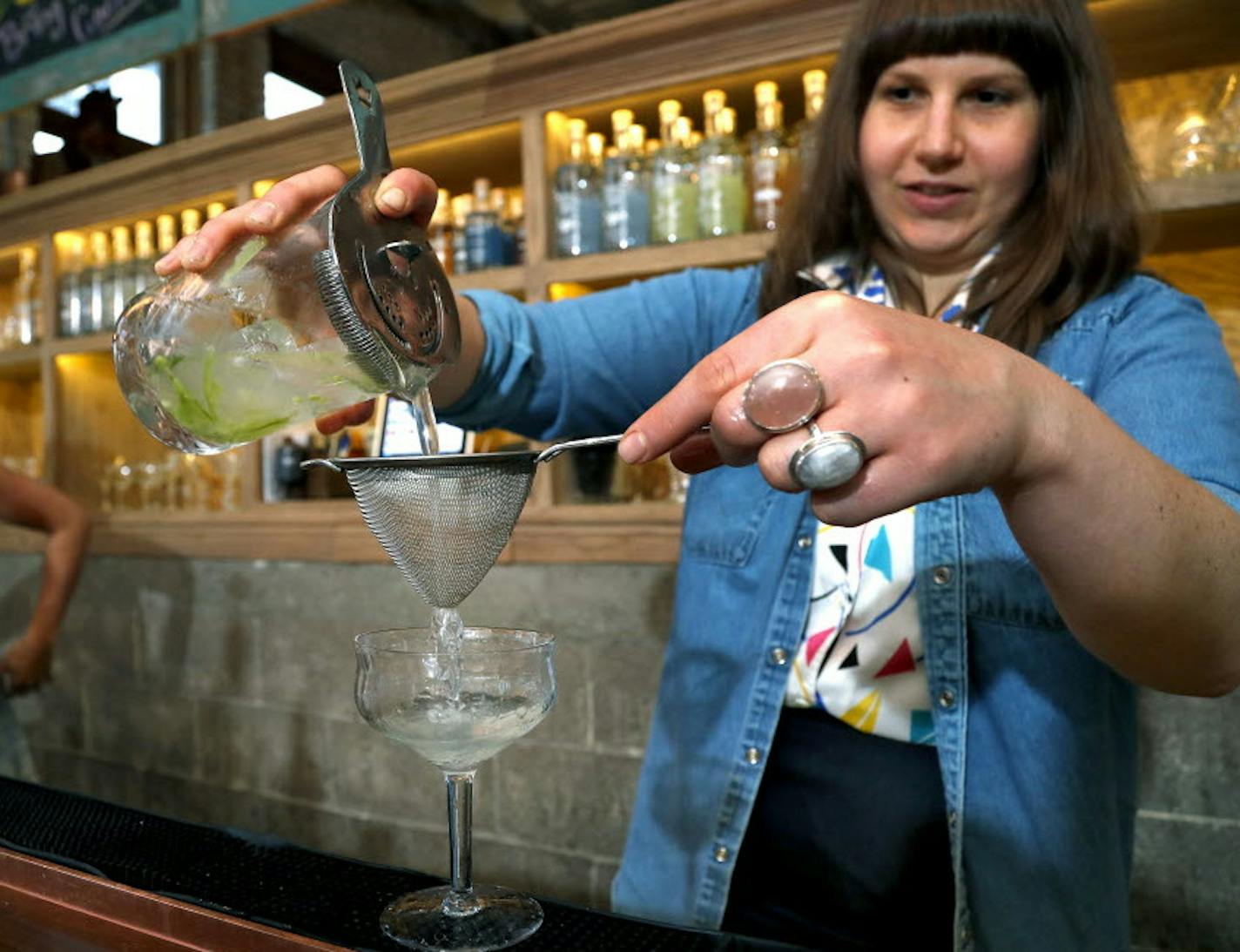 Bartender Hally Sharrow prepared a drink on June 4, 2016 at Vikre Distillery in the Canal Park area of Duluth -- one of the few distilleries outside the Twin Cities. Brainerd hopes to be the next Greater Minnesota city with a distillery, attracting both new residents and tourists.