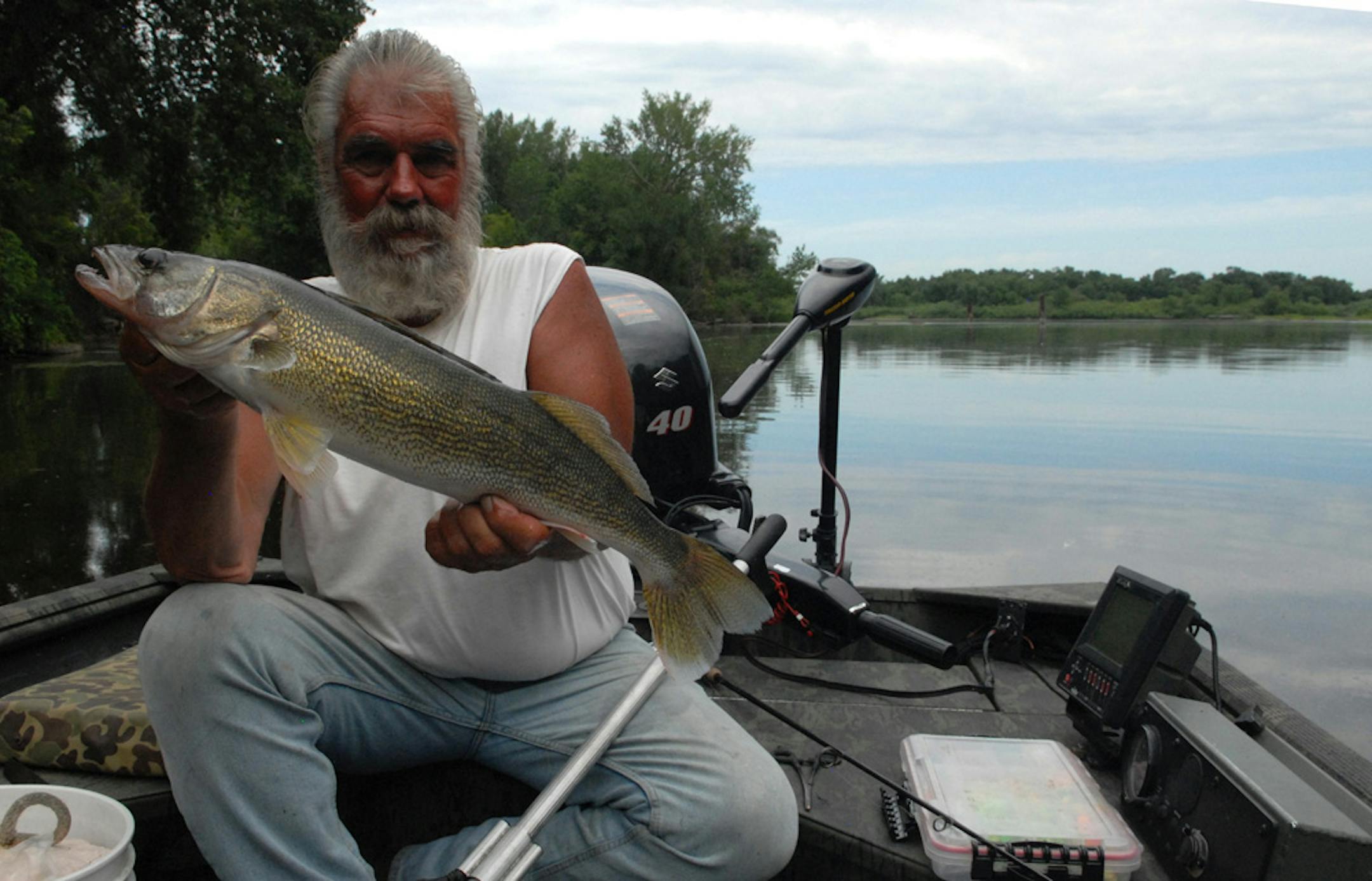 Dick "Griz'' Grzywinski displayed a big walleye caught on the Mississippi near downtown St. Paul.