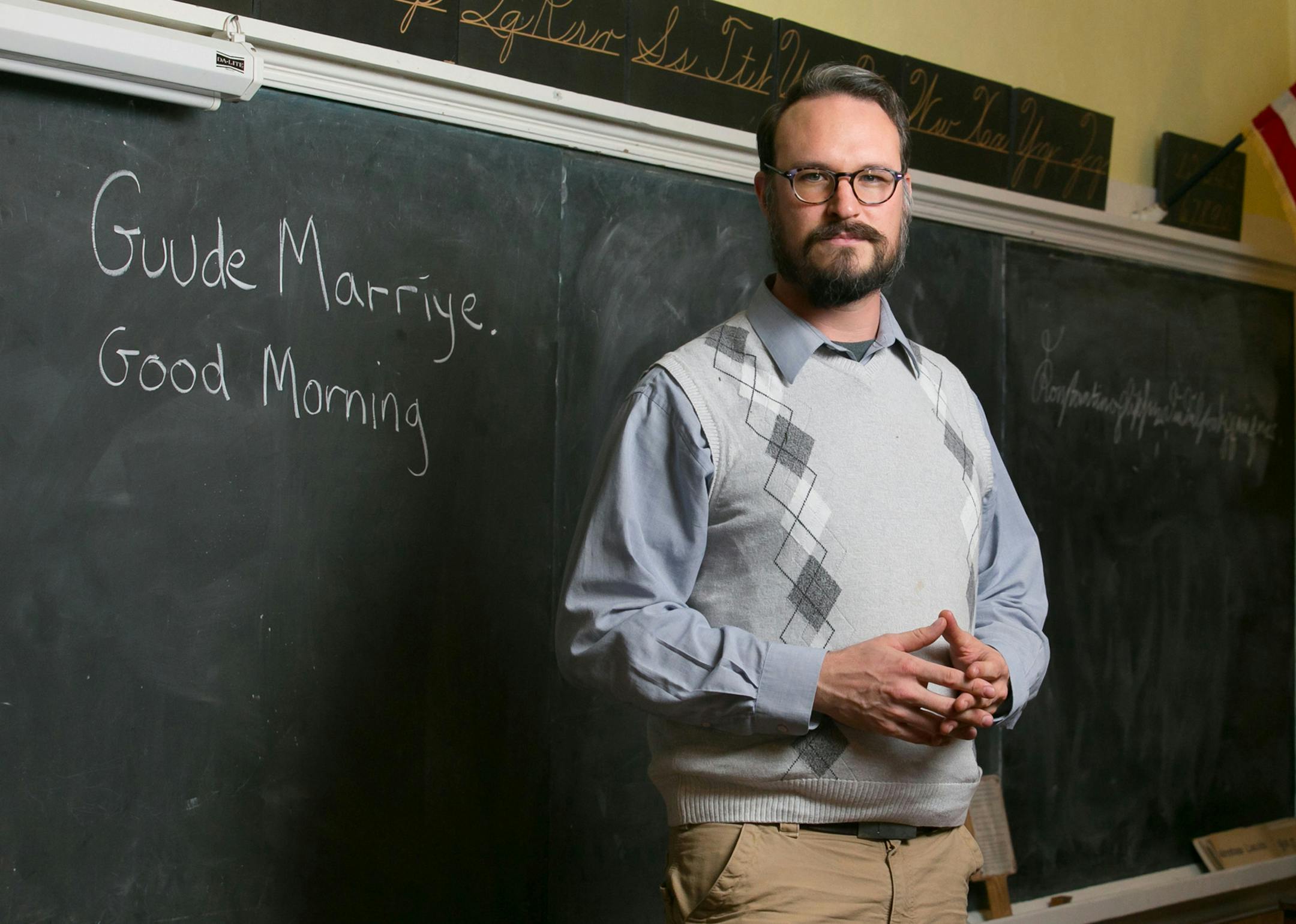 Patrick Donmoyer, building conservator and exhibit specialist, shown here in the schoolroom on Tuesday, Nov. 28, 2017 at the Pennsylvania German Cultural Heritage Center, at Kutztown University, in Pennsylvania, Pa. (Jessica Griffin/Philadelphia Inquirer/TNS)
