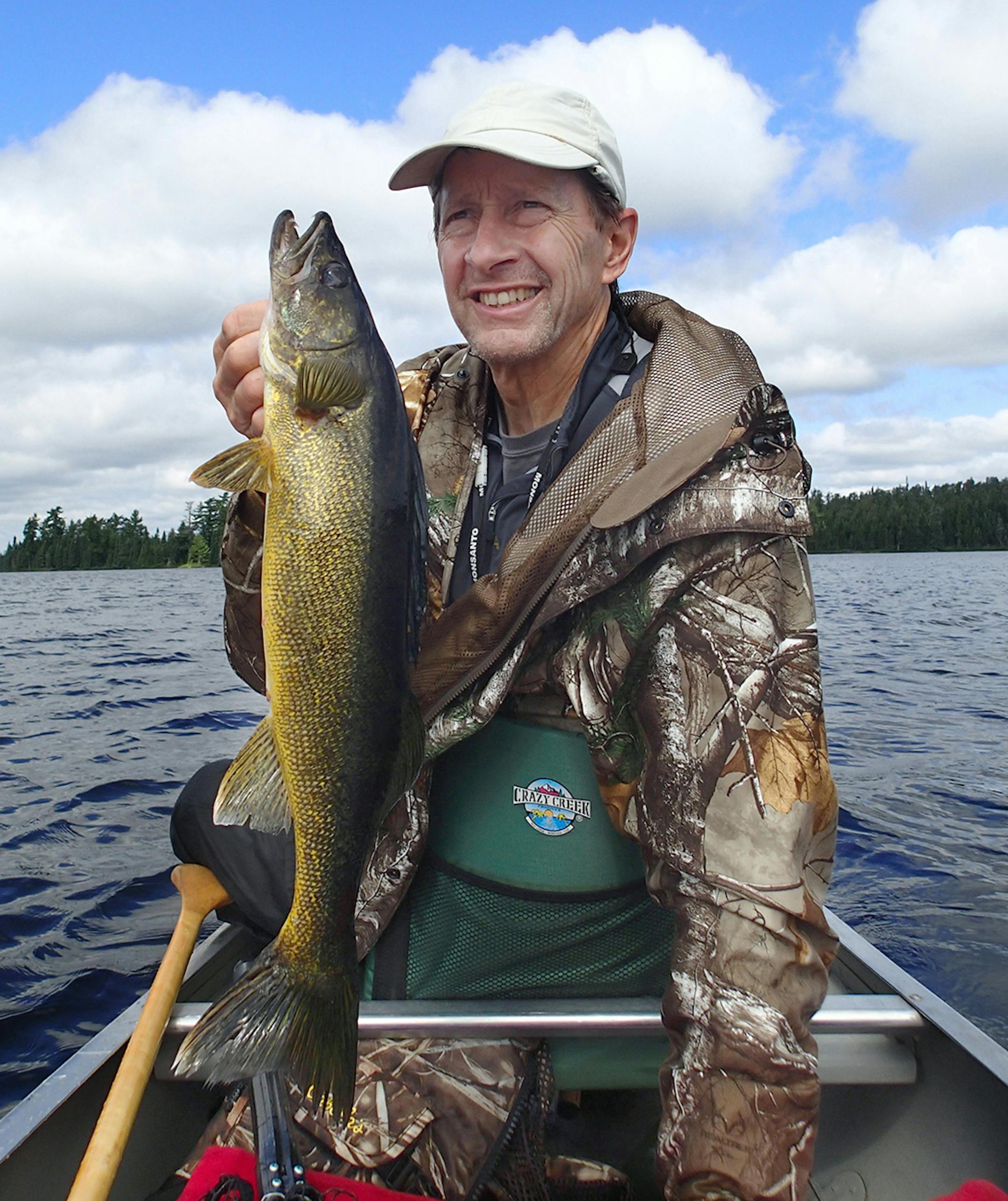 Marv Boerboom of Alexandria, Minn., holds a 27-inch walleye he caught on a remote Ontario lake, one of several big walleyes he and his six-member group landed.