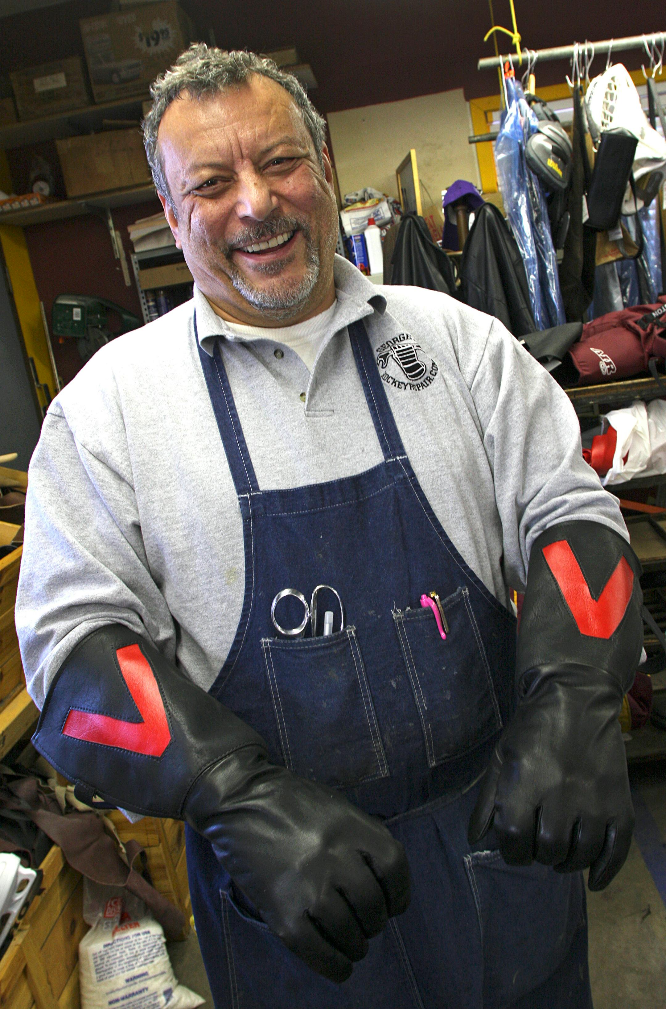 Jerry George showed off custom gloves he made for the St. Paul Winter Carnival Vulcans.