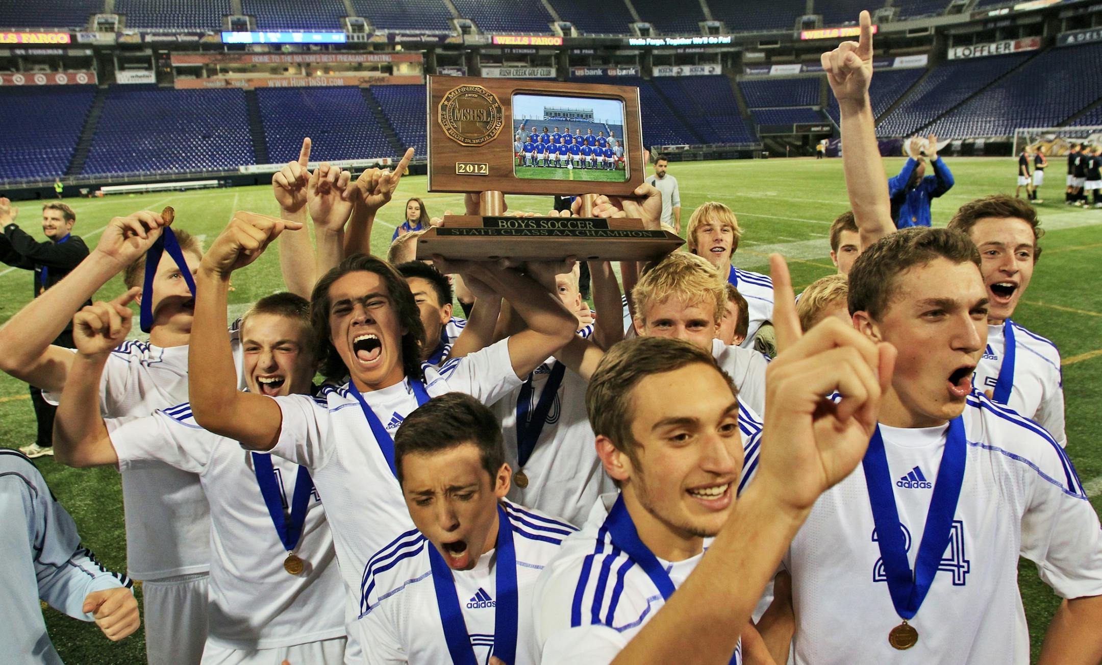 Boys 2A Soccer Championship - Blaine vs. Eastview. Eastview won 3-2. Eastview players celebrated with the championship trophy. (MARLIN LEVISON/STARTRIBUNE(mlevison@startribune.com
