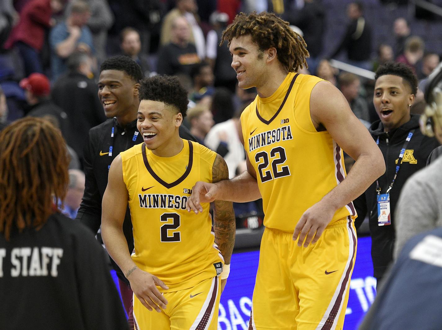 Minnesota center Reggie Lynch (22) and guard Nate Mason (2) react as they leave the court after an NCAA college basketball game against Michigan State in the Big Ten tournament, Friday, March 10, 2017, in Washington. Minnesota won 63-58. (AP Photo/Nick Wass)