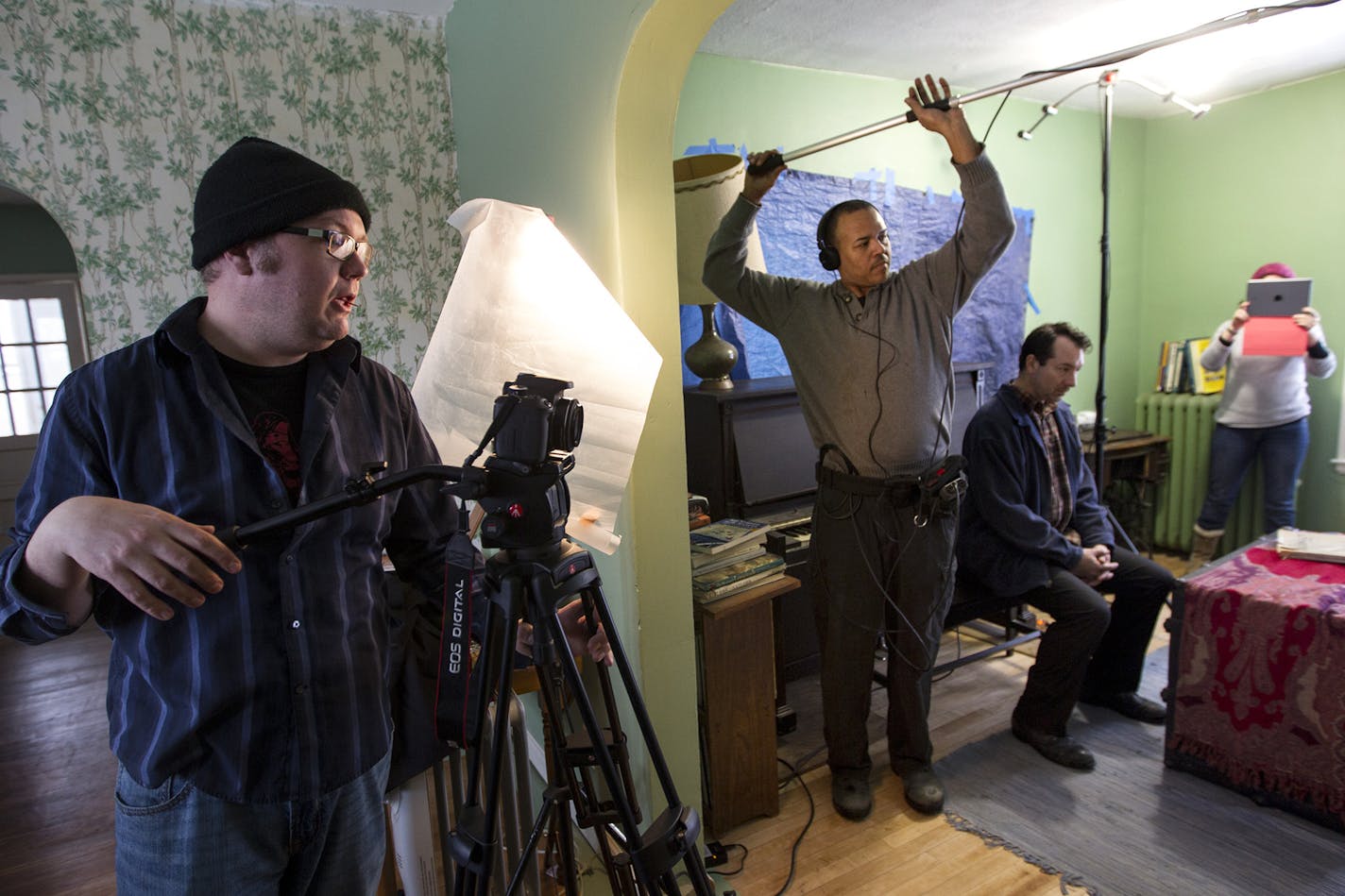 Left to right, writer and director Matthew G. Anderson, sound and light technician Mickey Richardson, and actor Mark L. Mattison prepare to run a scene as Theater People films a web episode in a farm house in Minnetrista January 17, 2015. (Courtney Perry/Special to the Star Tribune)