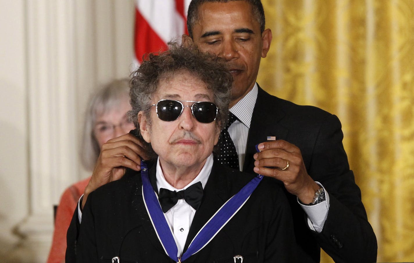 President Obama presents rock legend Bob Dylan with a Medal of Freedom, Tuesday, May 29, 2012, during a ceremony at the White House in Washington.