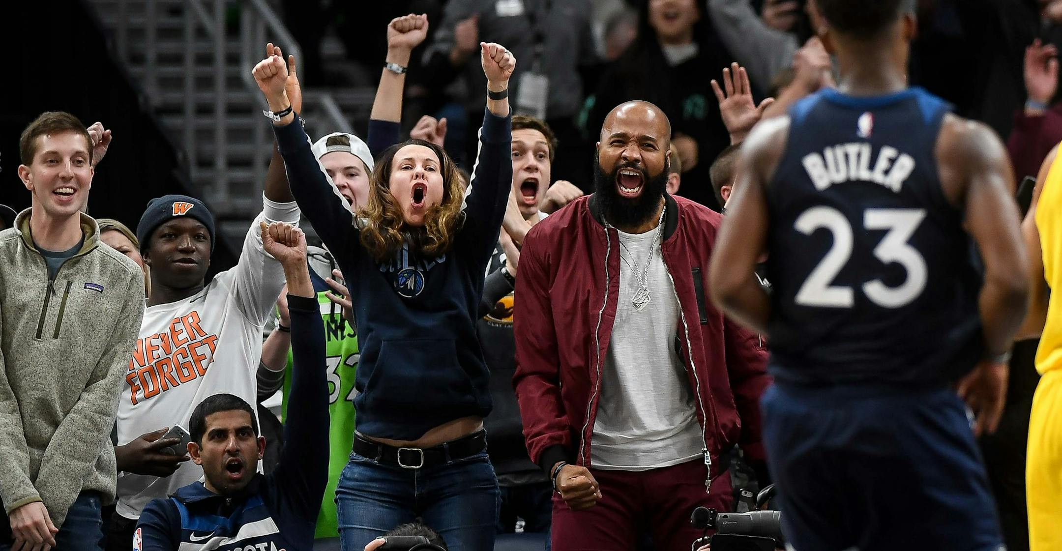 Fans celebrated after a basket by Minnesota Timberwolves guard Jimmy Butler (23), forcing a Denver Nuggets timeout in overtime. ] AARON LAVINSKY ï aaron.lavinsky@startribune.com The Minnesota Timberwolves played the Denver Nuggets on Wednesday, Dec. 27, 2017 at Target Center in Minneapolis, Minn.