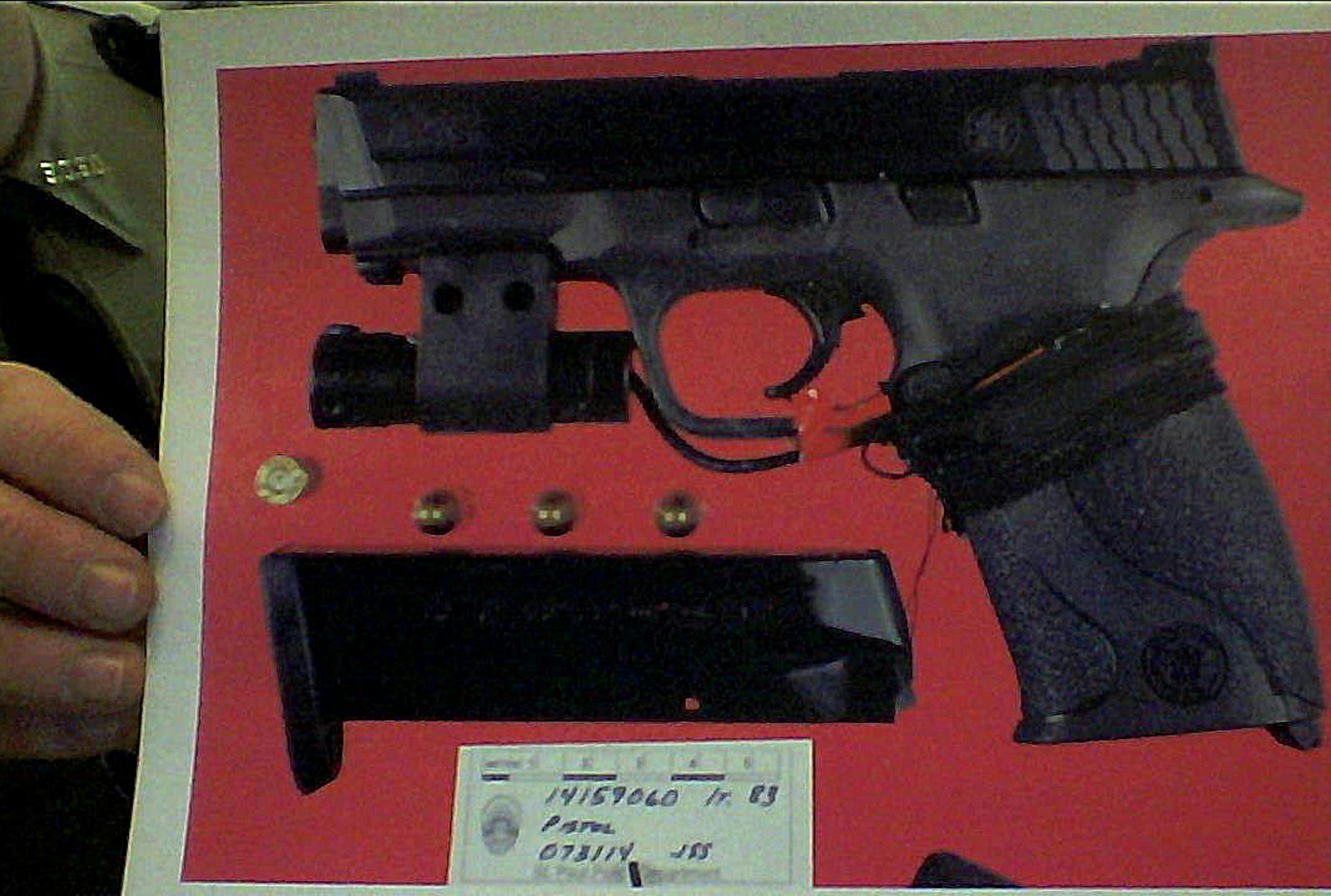 Fitch Trial ... The black gun is the gun police say Fitch used to shoot Patrick. It's a Smith and Wesson 9mm with a laser sight attached to it.