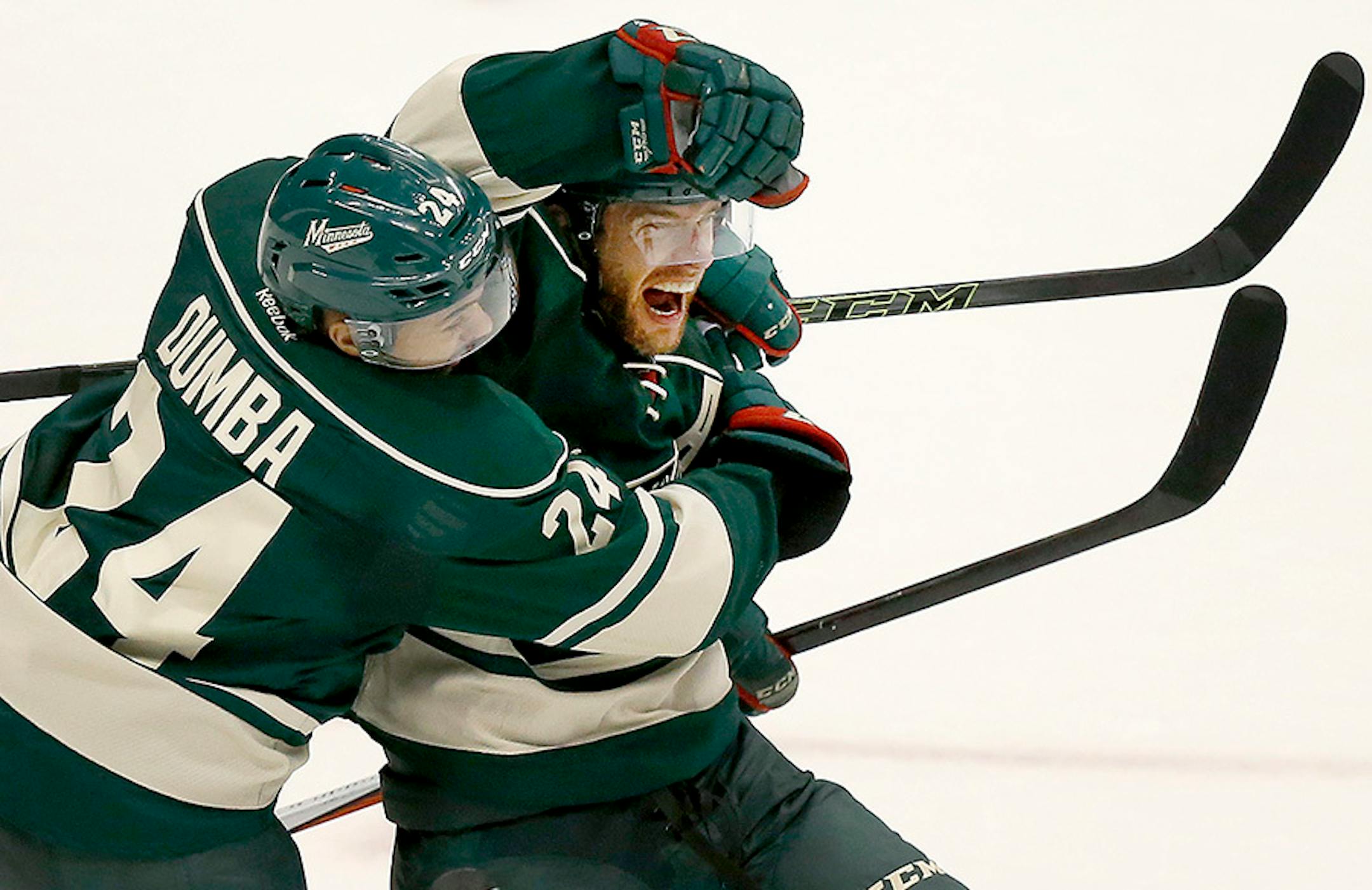 Jason Pominville (29) celebrated with Matt Dumba (24) after scoring goal in the second period.