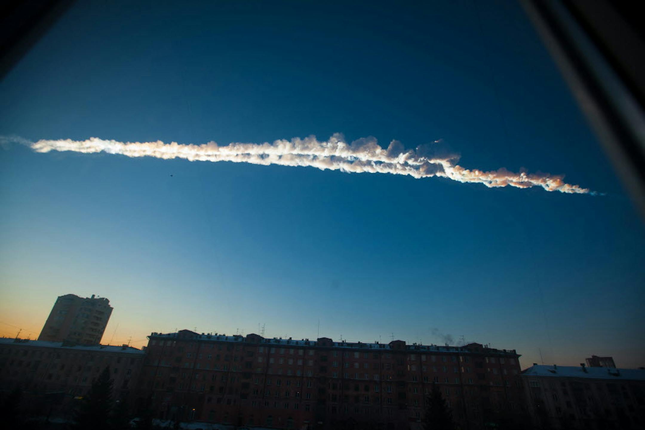 Feb. 15, 2013: A meteorite contrail over the Ural Mountains' city of Chelyabinsk, about 930 miles east of Moscow, Russia.