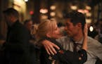 Jacob Frey hugged his wife, Sarah Clarke, as early results trickled in at his election night headquarters in Minneapolis.