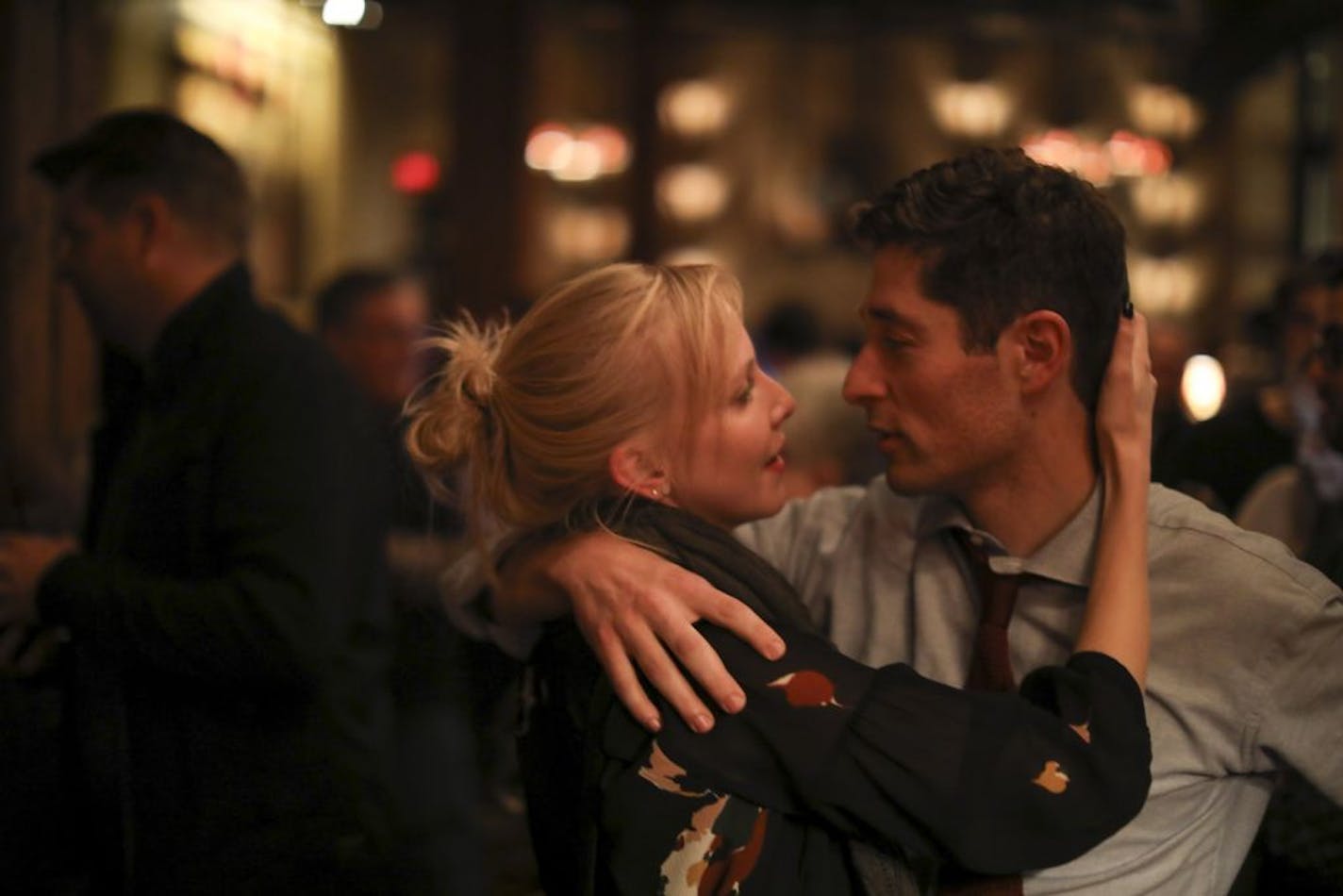 Jacob Frey hugged his wife, Sarah Clarke, as early results trickled in at his election night headquarters in Minneapolis.