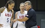 United States forward Seimone Augustus (5) and guard Lindsay Whalen listen to head coach Geno Auriemma during the second half of a women's basketball 