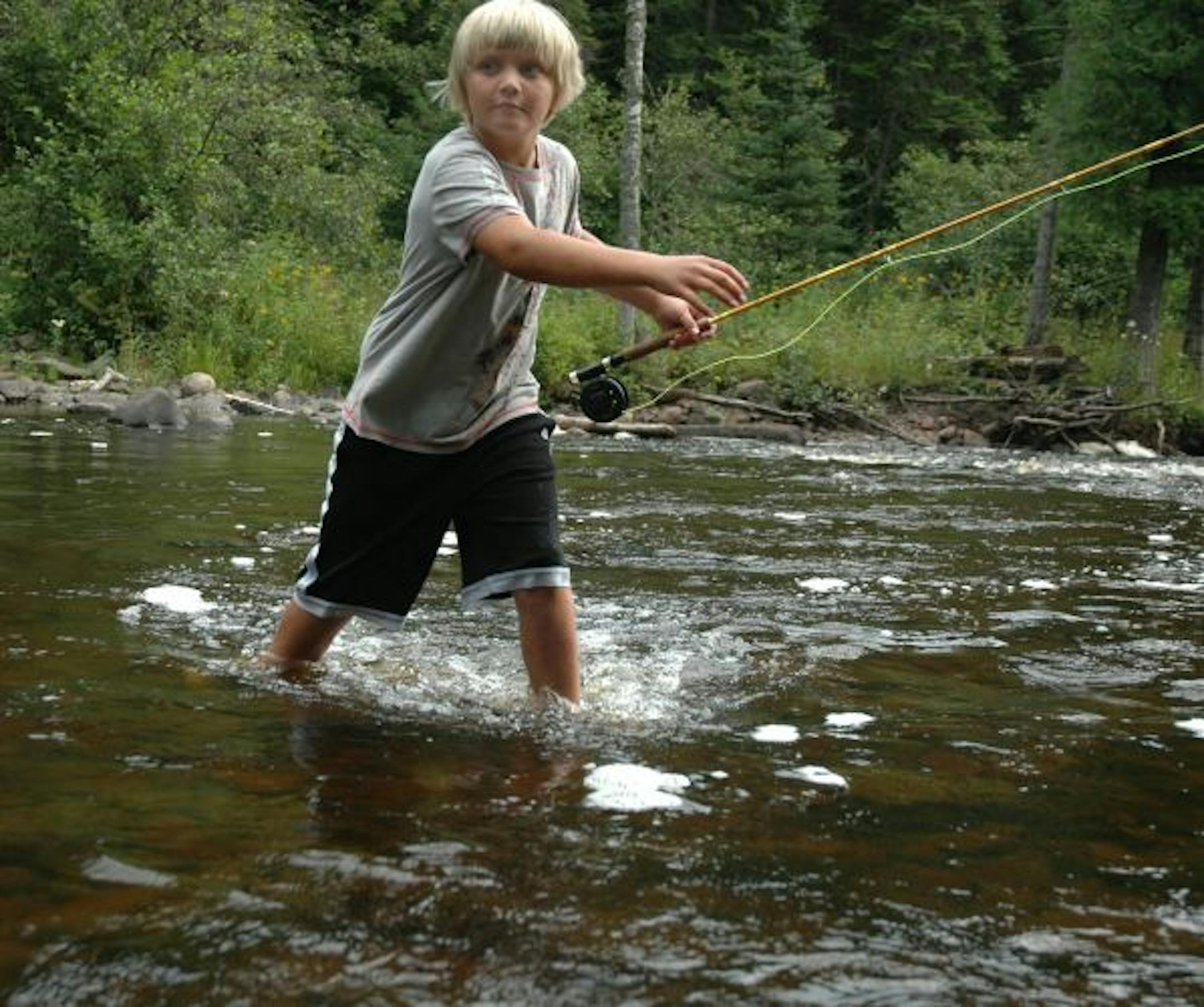 Chayse Buchta tip-toes through the river during a flyfishing lesson at Lutsen Lodge and Resort.