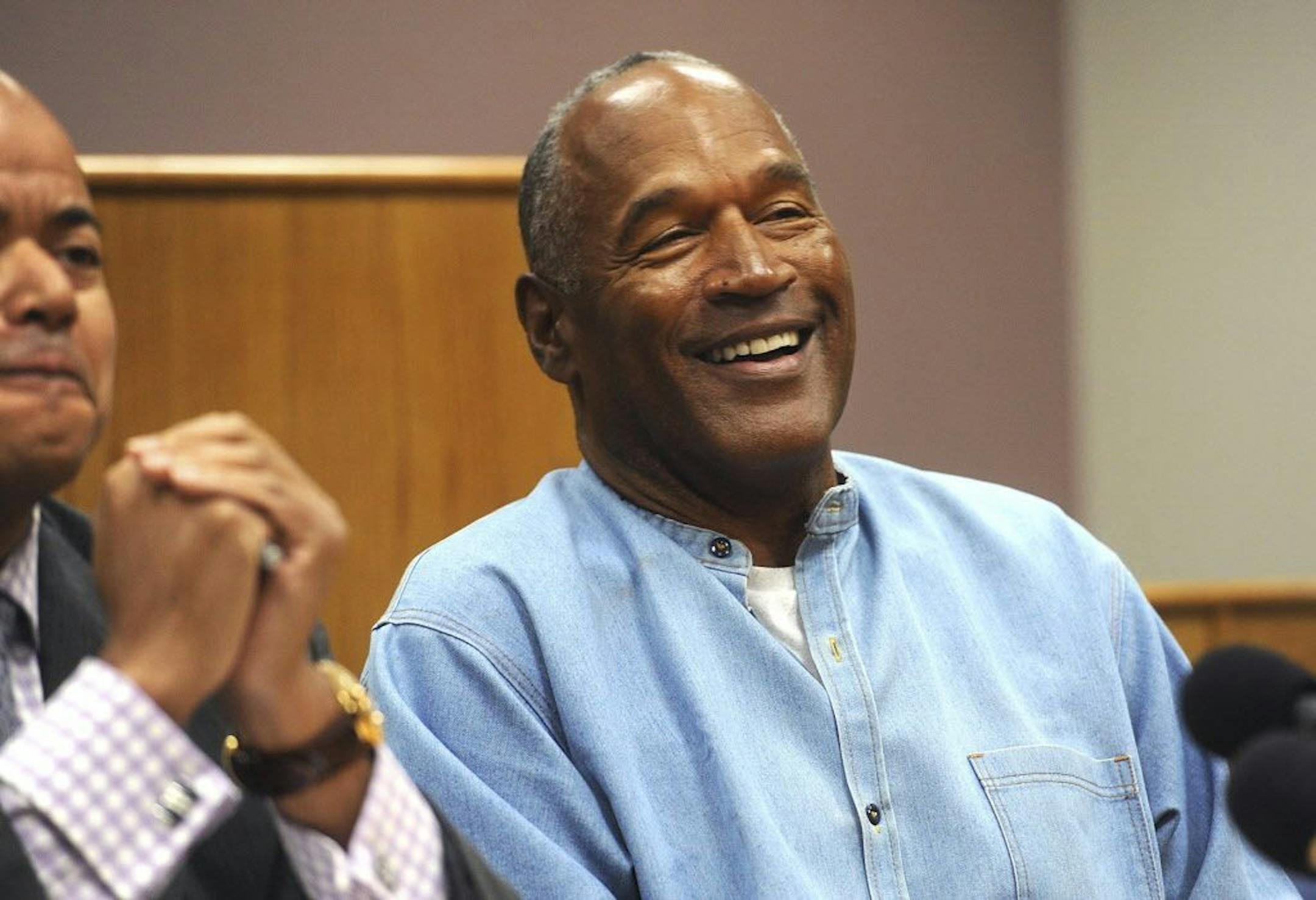 O.J. Simpson reacts at a hearing where he was granted parole, at the Lovelock Correctional Center in Nevada, July 20, 2017. Simpson will go free after serving nine years in a Nevada prison on charges stemming from an armed robbery in Las Vegas, the board ruled.