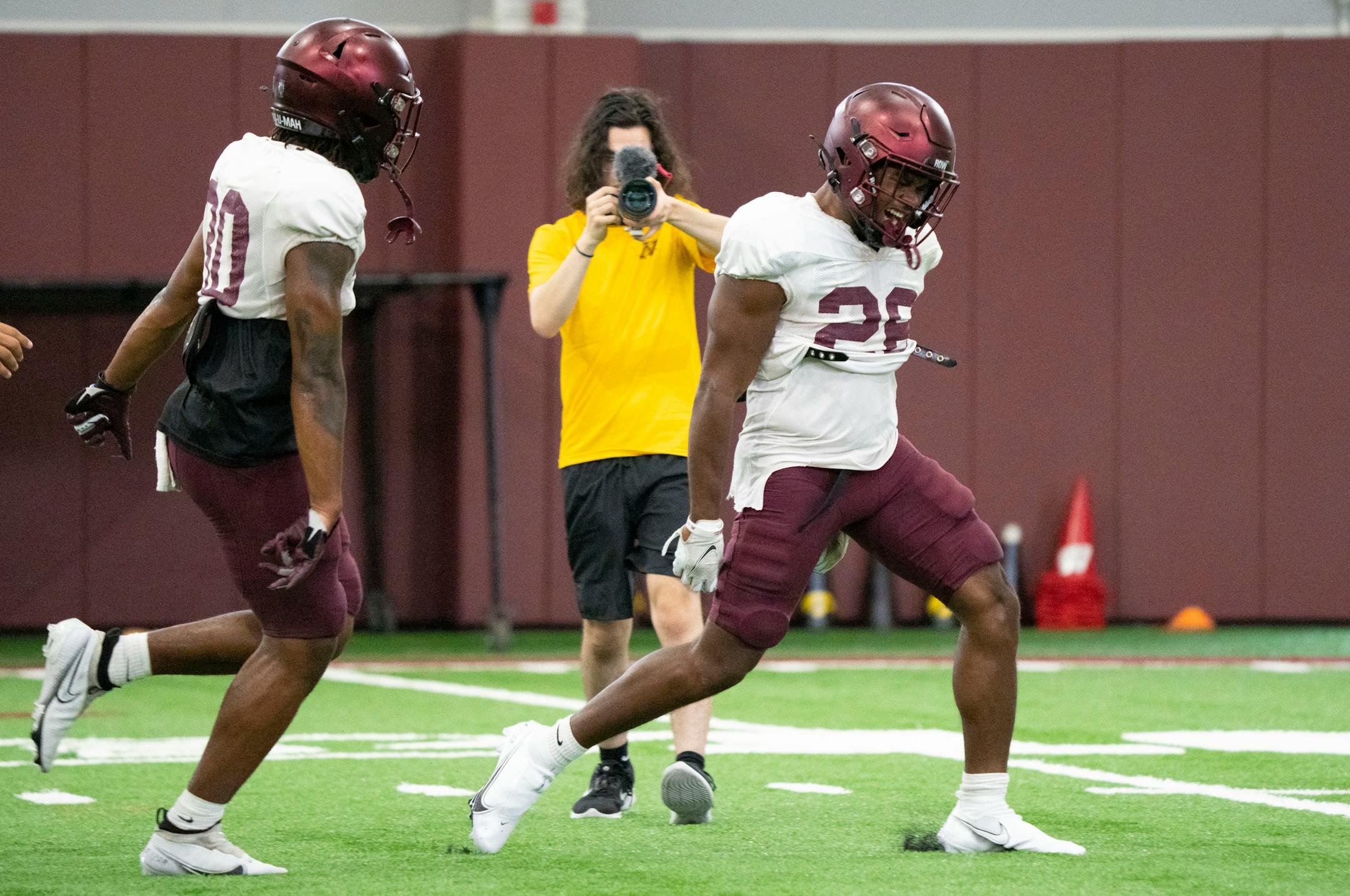 Gophers running back Zach Evans (26) celebrates after making a play during the football team's open practice Saturday.