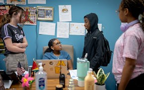 Anjali Hay listens to students as they make their way into her room at Murray Middle School in St. Paul on Friday. Minnesota was one of the first stat