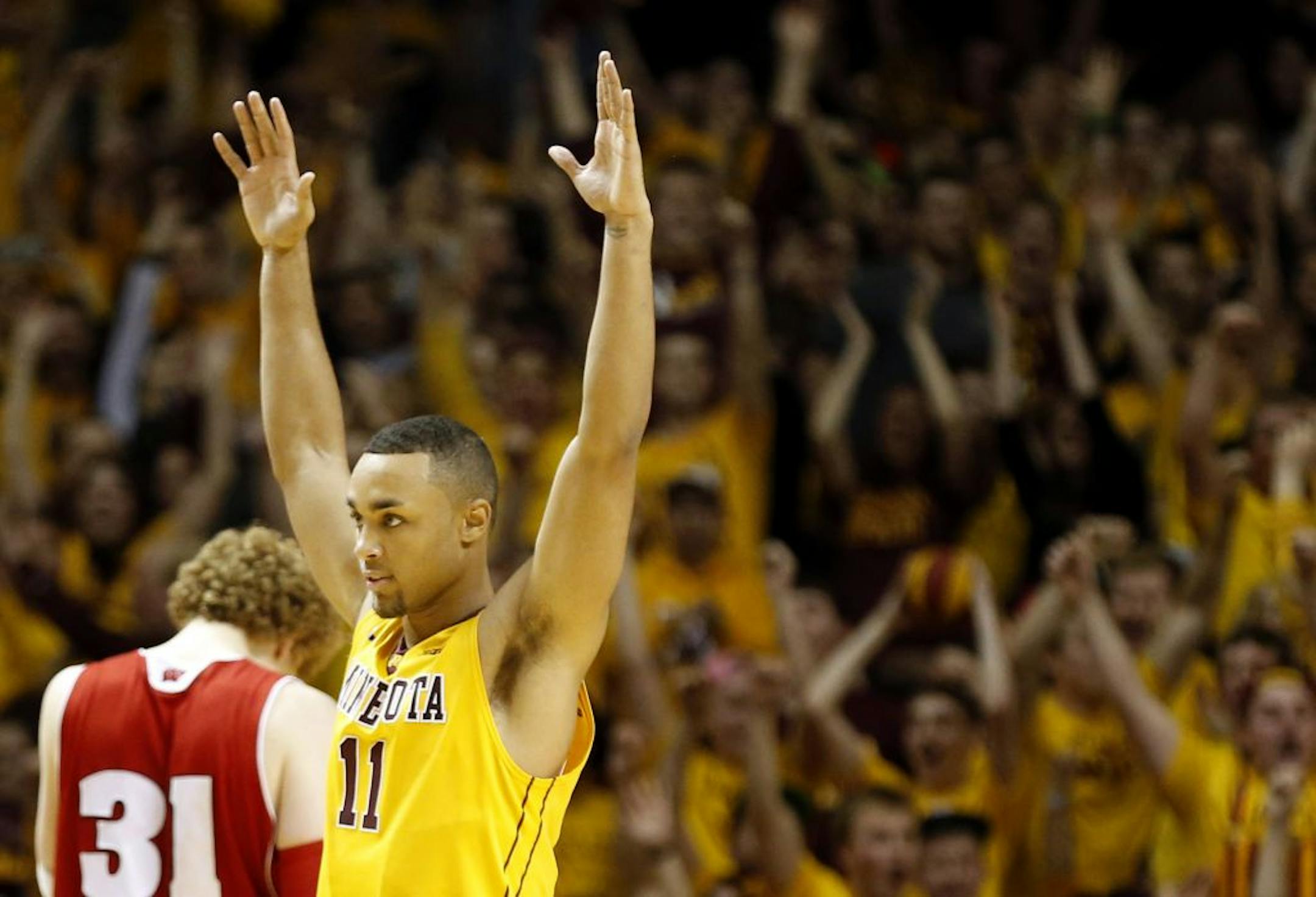 Gophers guard Joe Coleman celebrated at the end of the game. Minnesota beat Wisconsin by a final score of 58-53 in overtime.