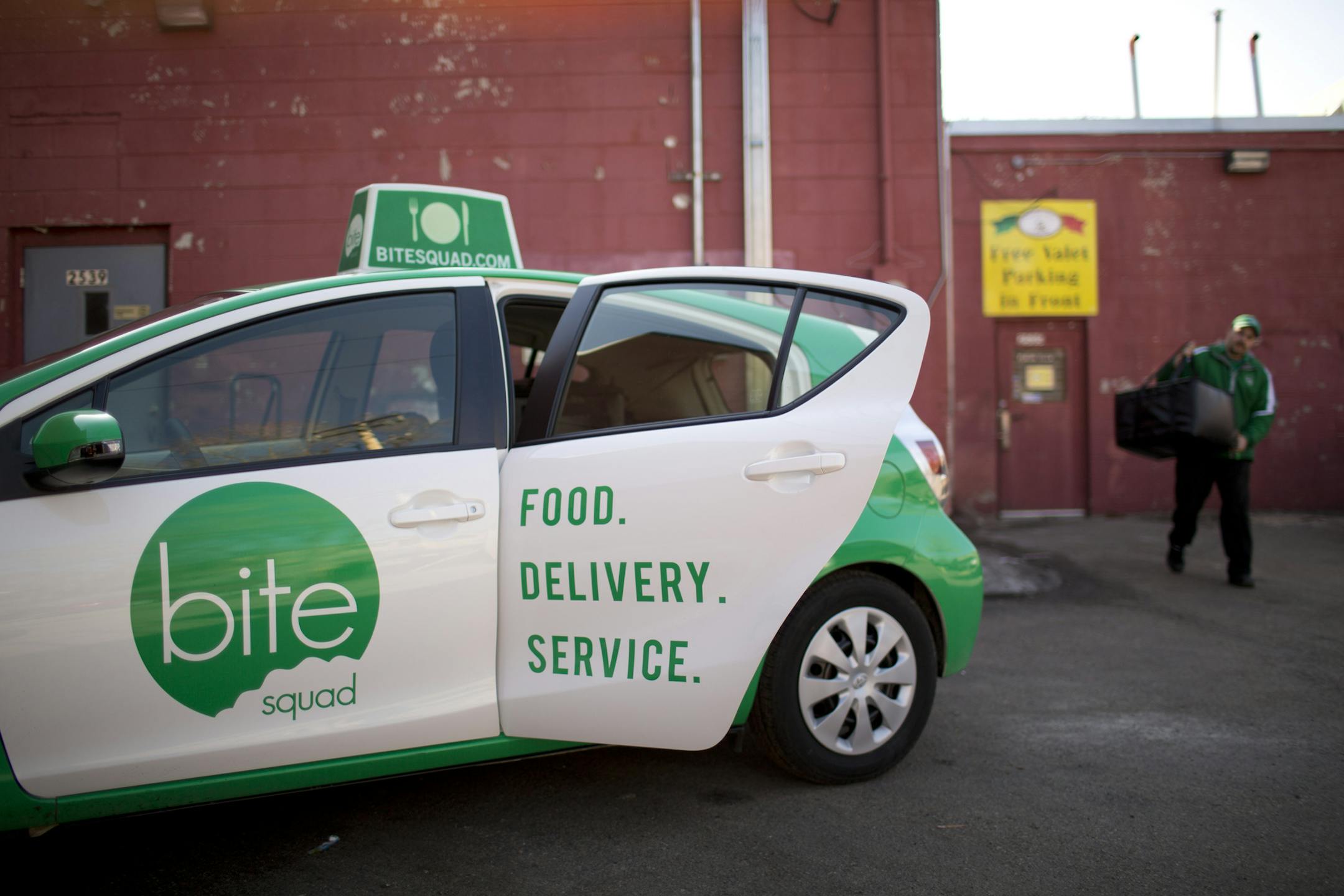 Restaurants are now outsourcing one of their onerous tasks, delivery. With food as a primary focus, restaurants can leave the delivery to a 3rd party. At least six delivery services have sprung up in the Twin Cities in the past year. Sean Dolan, a delivery driver for one of the new ones, Bite Squad, carried the food out to his vehicle that he was picking up at Pancho Villa's Bar & Grill on Eat Street in Minneapolis Thursday afternoon, April 4, 2013 before running it to an office building downtow