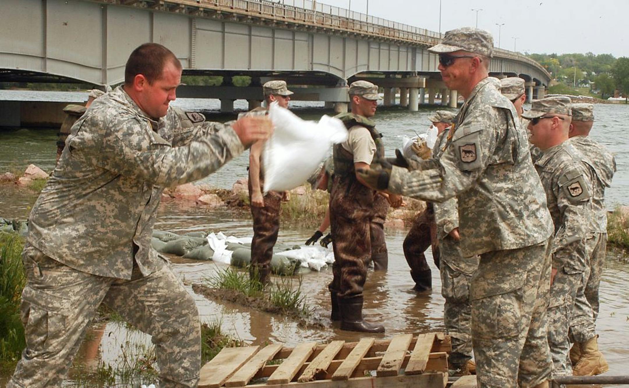 South Dakota National Guard members from Watertown, S.D., stacked sandbags to prevent floodwaters from the rising Missouri River from reaching an electrical box earlier this month.