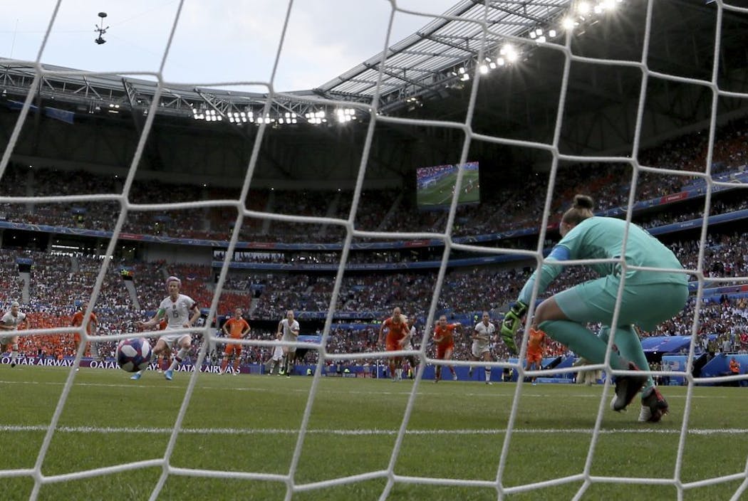 Netherlands goalkeeper Sari Van Veenendaal fails to save a penalty shot by United States' Megan Rapinoe.