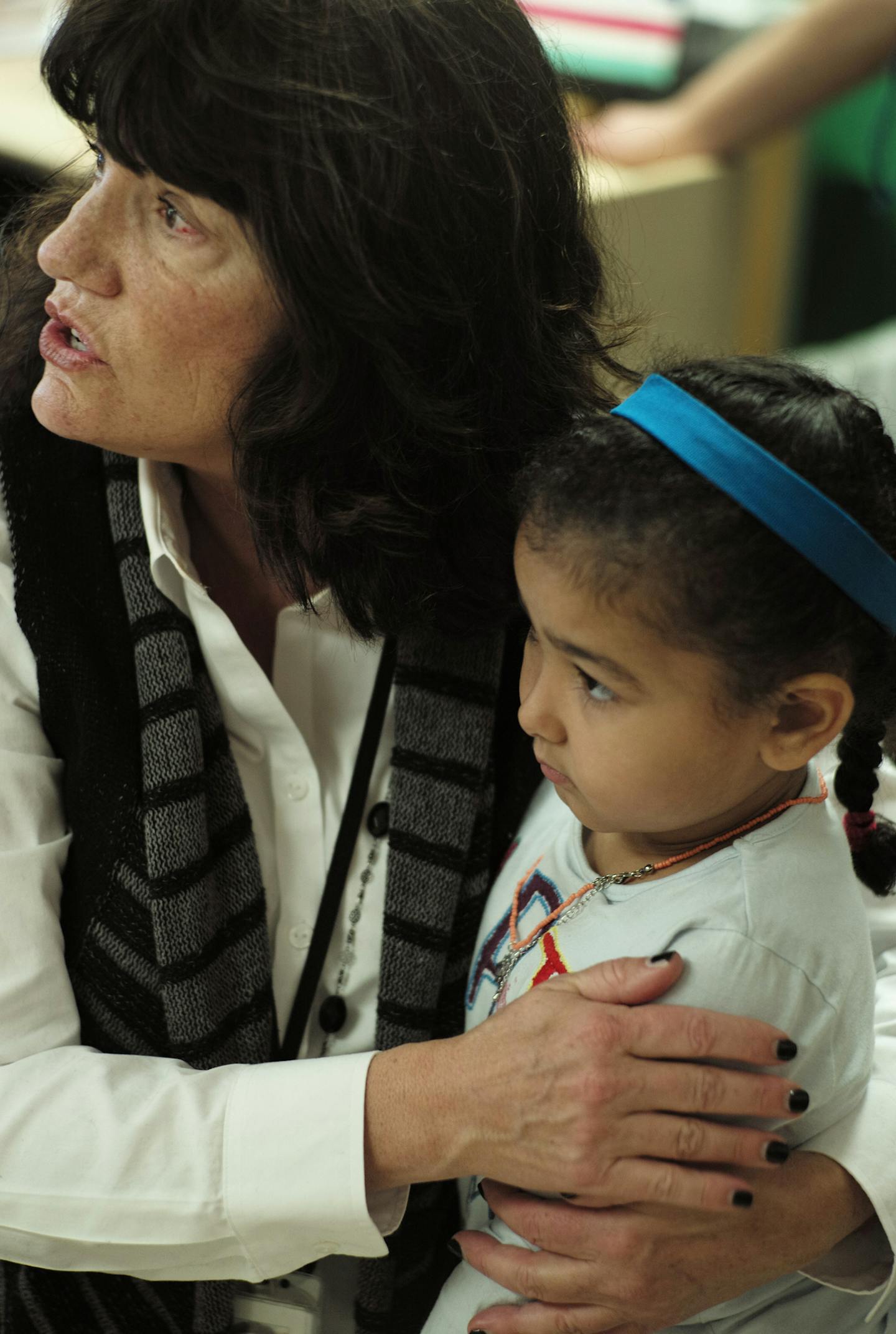 Monica Potter, program director, helped comfort Laila Igdi, who did not get a chance to color.] The 40th anniversay of ECFE in the north west metro is coming up.Richard Tsong-Taatarii/rtsong- taatarii@startribune.com