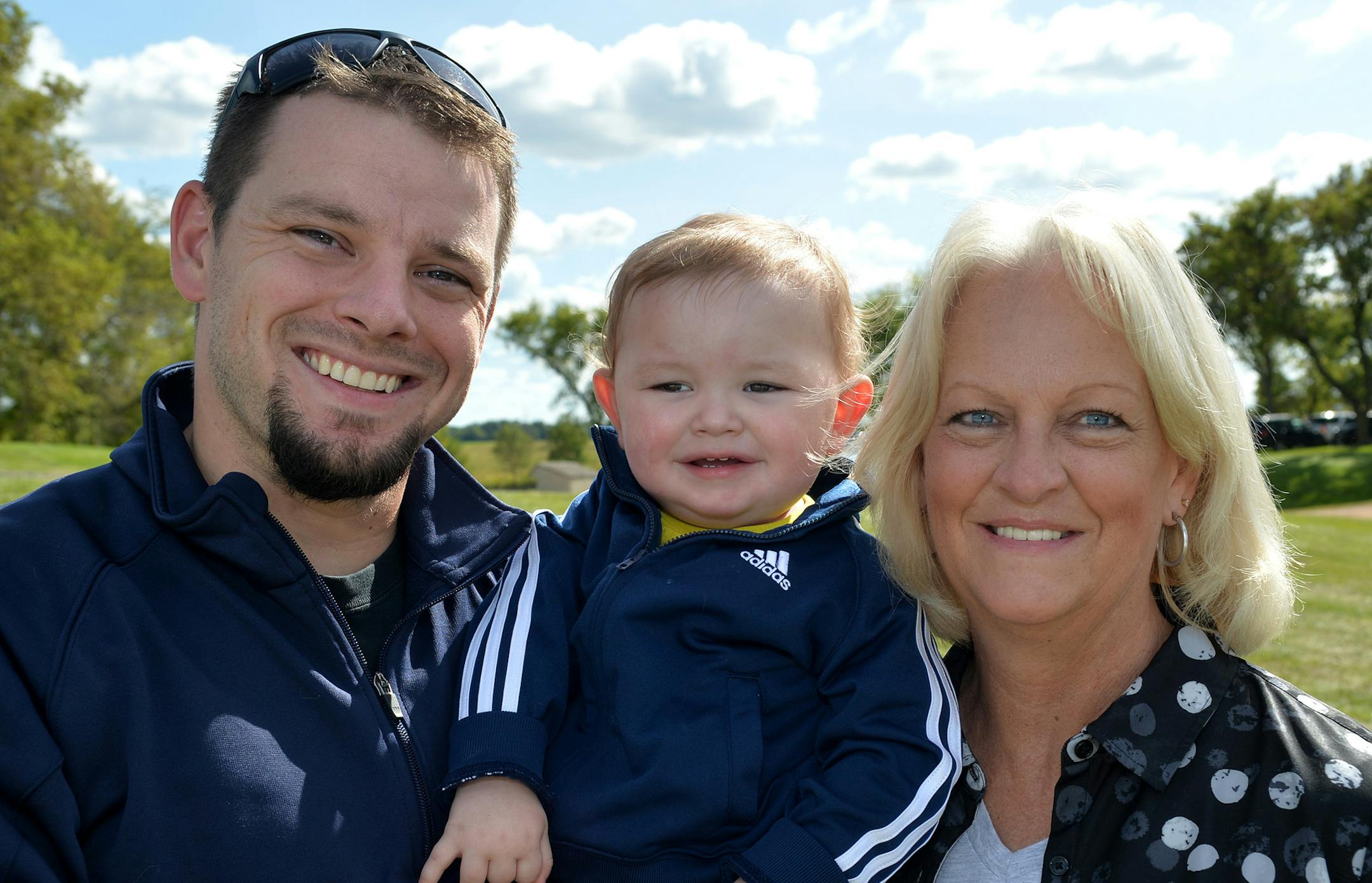 From left, Dan Jesmer, Gage Jesmer and Char Clouse. ] (SPECIAL TO THE STAR TRIBUNE/BRE McGEE) **Dan Jesmer (left, father of Gage), Gage Jesmer (center, 18-months-old, son of Dan), Char Clouse (right), Freedom Farm Polo Event