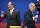 Chinese Vice President Wang Qishan, left, and U.S. Ambassador to China Terry Branstad toast during an event commemorating the 40th anniversary of the 