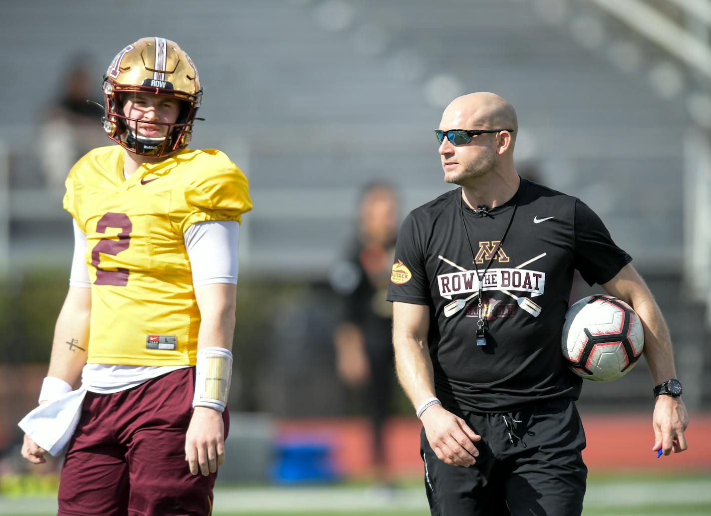 Minnesota Gophers head coach PJ Fleck and quarterback Tanner Morgan (2) talked during Sunday's practice.