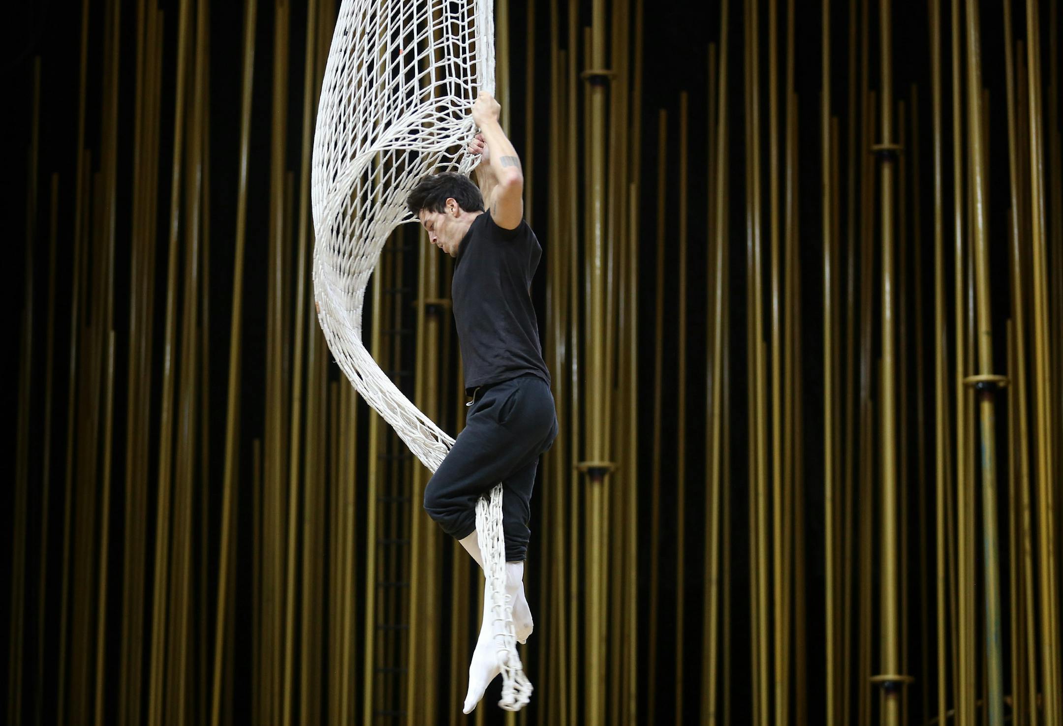 Fernando Miro who plays Icarus, went through his aerial performance with the net during rehearsal. ] (KYNDELL HARKNESS/STAR TRIBUNE) kyndell.harkness@startribune.com Cirque du Soleil Varekai open practice at the Target Center in Minneapolis Min., Wednesday, December 24, 2014. ORG XMIT: MIN1412241227430832