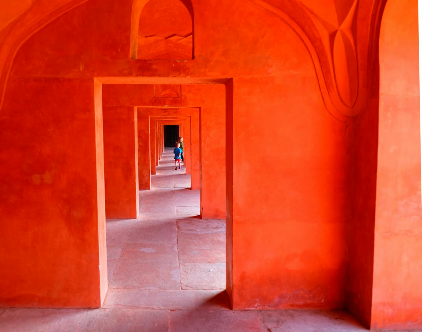 The pavilions of Fatehpur Sikri in Agra glow in red sandstone, and two boys darted among them.