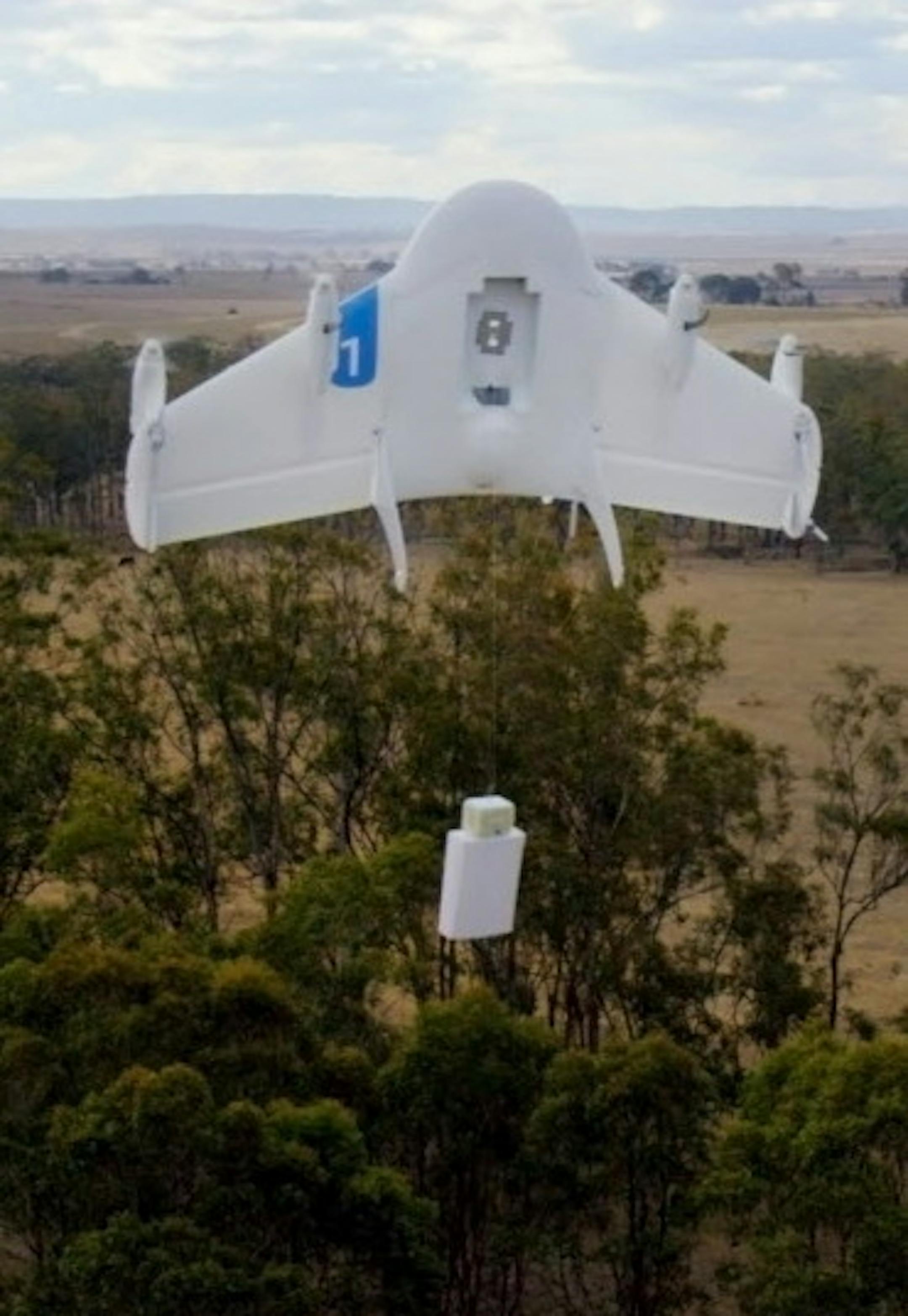 This undated image provided by Google shows a Project Wing drone vehicle during delivery. Google's secretive research laboratory is trying to build a fleet of drones designed to bypass earthbound traffic so packages can be delivered to people more quickly. The ambitious program announced Thursday, Aug. 28, 2014, escalates Google's technological arms race with rival Amazon.com Inc., which also is experimenting with self-flying vehicles to carry merchandise bought by customers of its online store.