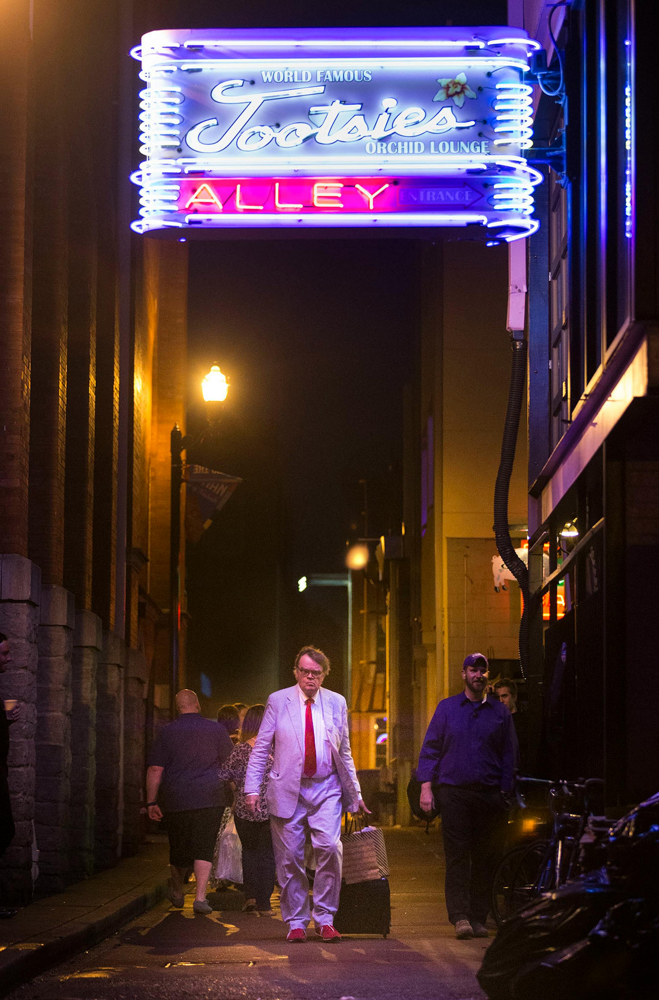 Garrison Keillor walked through the alley from the stage entrance of the Ryman Auditorium after a show.