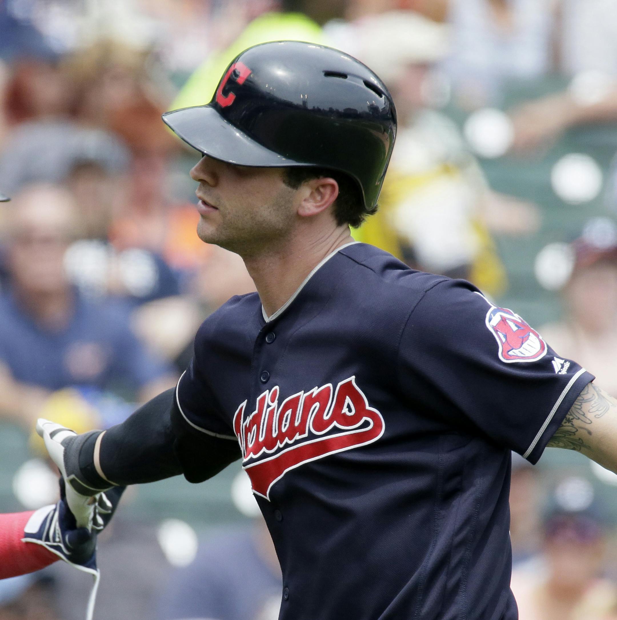 Cleveland Indians' Tyler Naquin, right, is congratulated by Carlos Santana after hitting a solo home run against the Detroit Tigers during the fifth inning of a baseball game Sunday, June 26, 2016, in Detroit. (AP Photo/Duane Burleson)